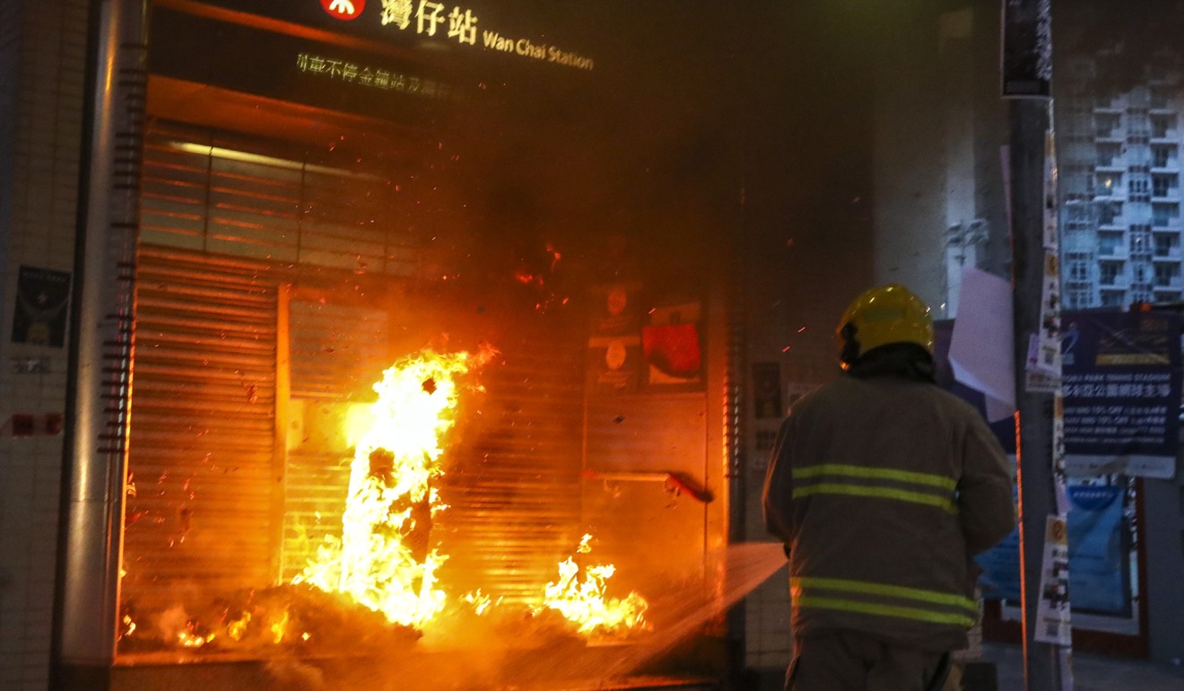 A fire started by protesters outside Wan Chai MTR station. Photo: Felix Wong