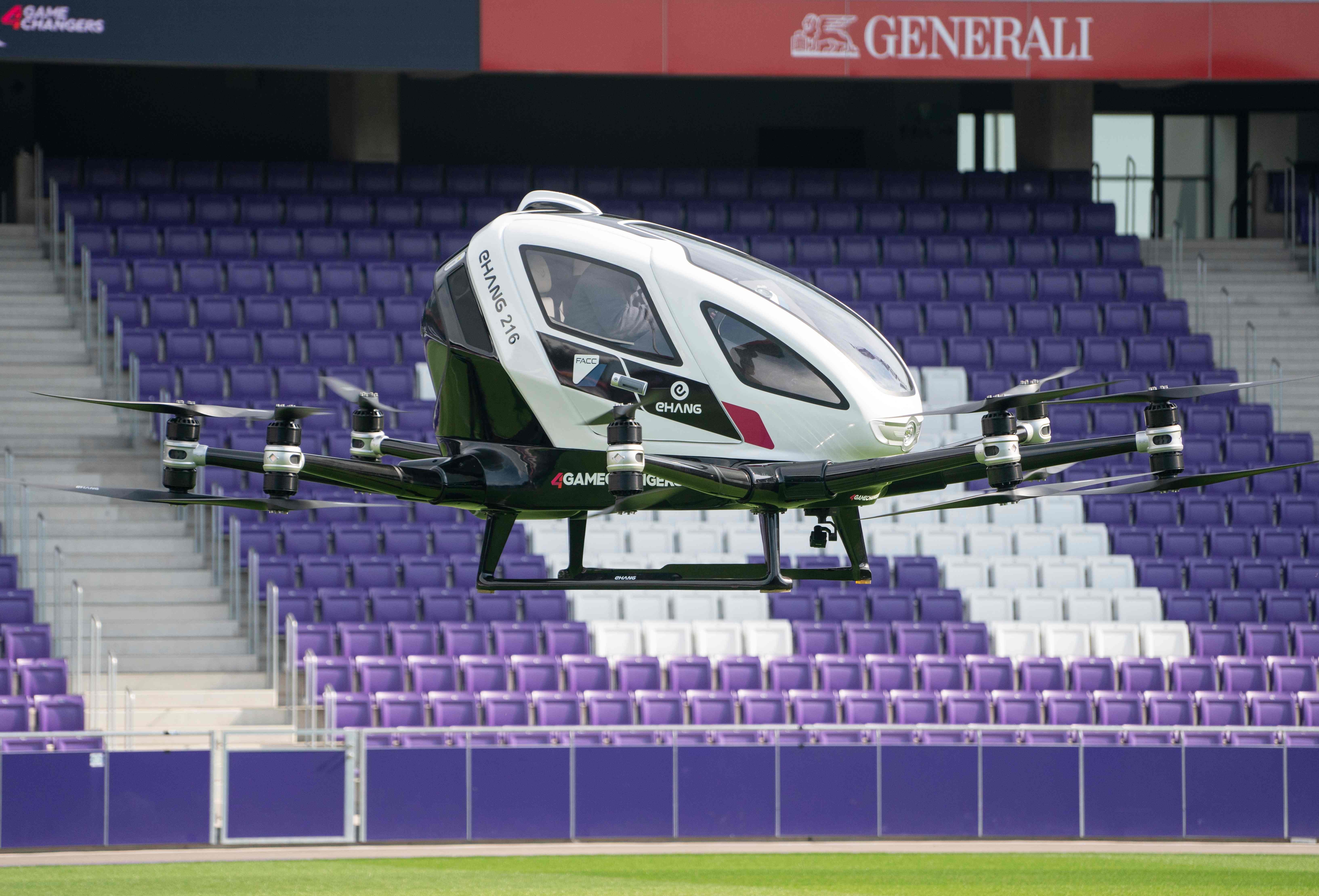 The two-seater EHang 216, an electric-powered autonomous flying taxi, takes a short flight during its launch in April this year at Generali Arena in Vienna, Austria. Photo: Agence France-Presse