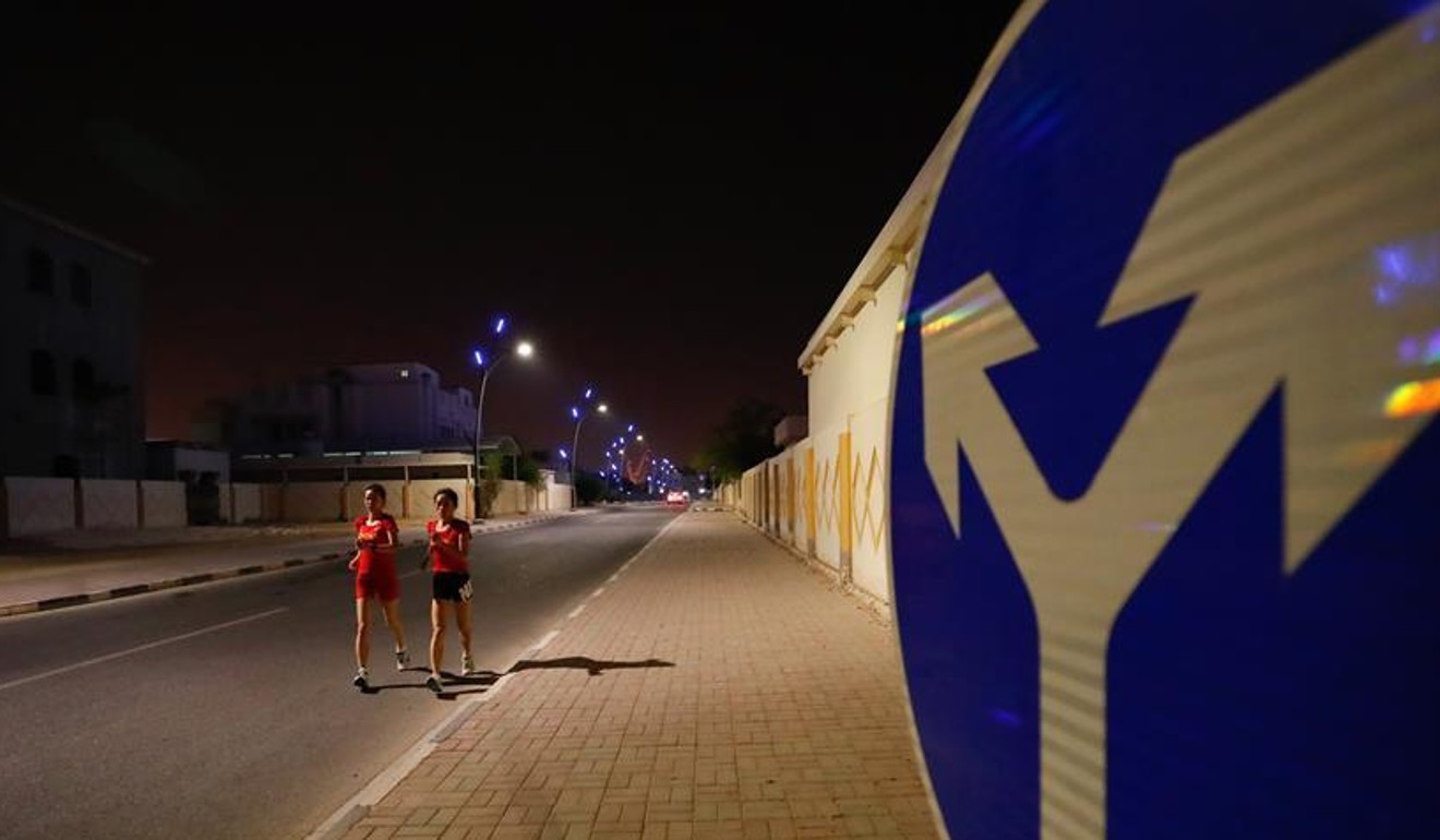 Chinese race walking athletes train at night time in Doha to prepare for the World Championships race on Sunday