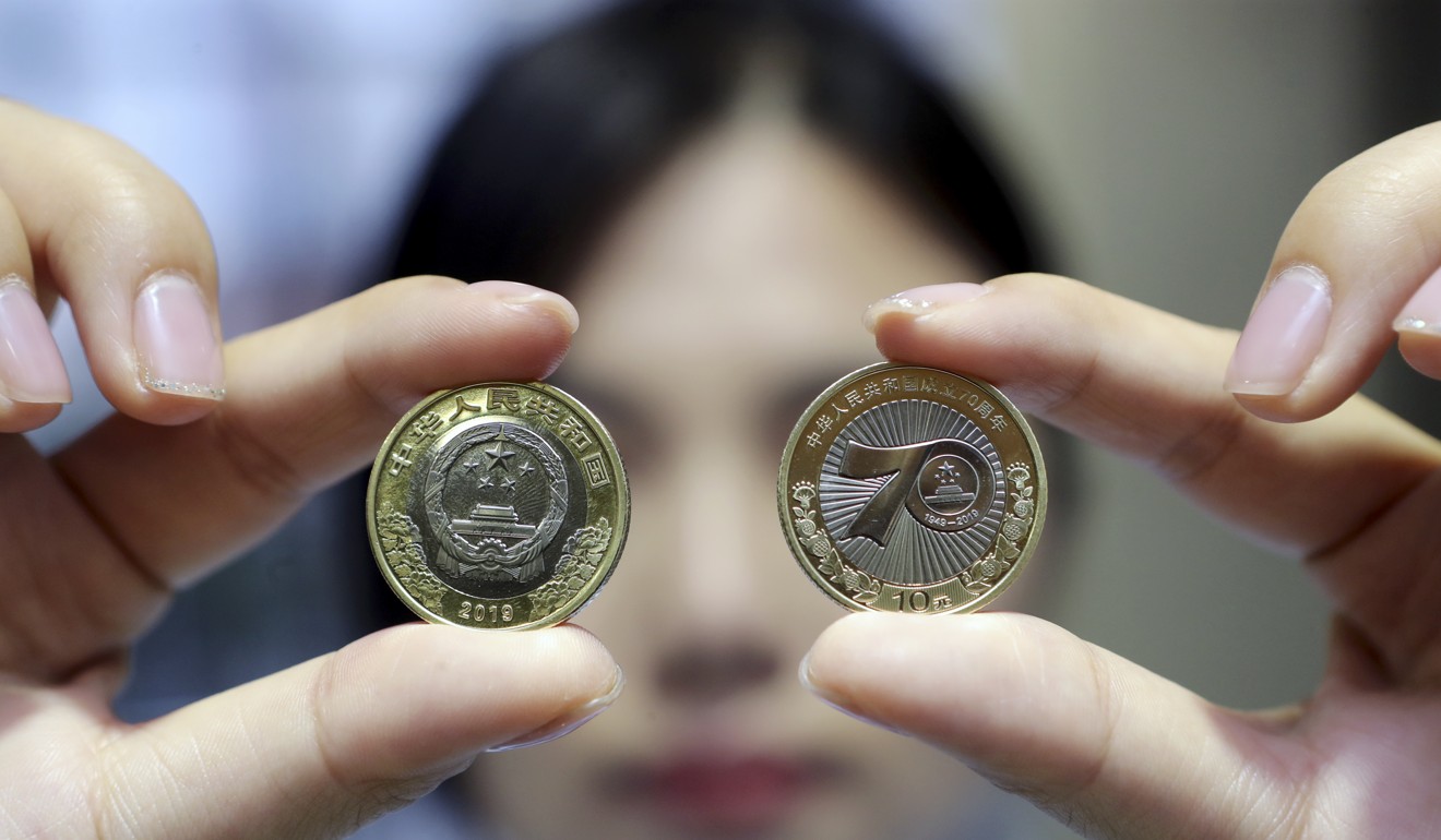 The 10 Yuan commemorative coin issued for China’s 70th National Day. In the past 40 years, China has witnessed an economic miracle. Photo: Imaginechina