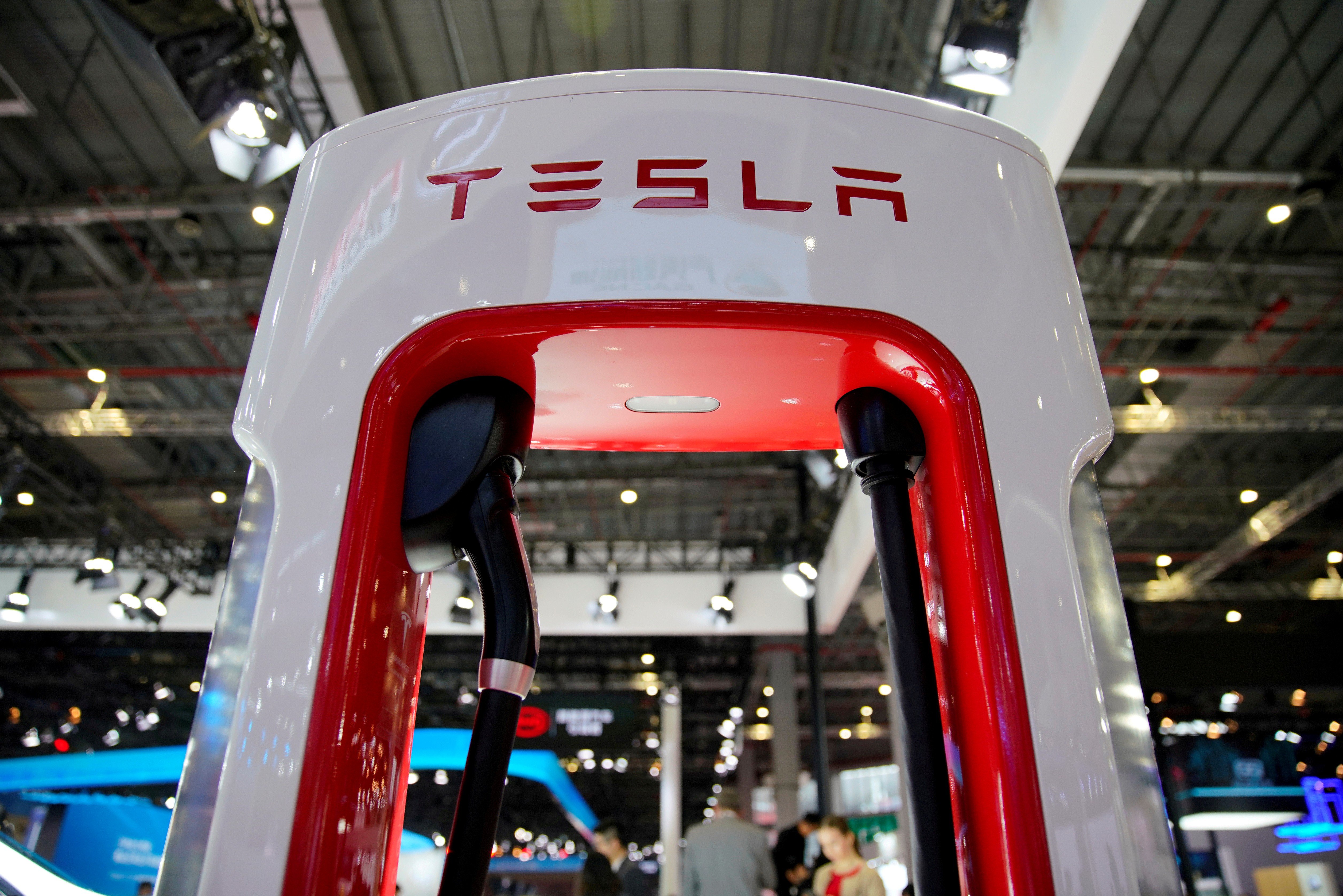 A Tesla charging station at a Shanghai car show. The American electric vehicle maker is set to start production by the end of this year in its wholly owned manufacturing plant in Shanghai. Photo: Reuters