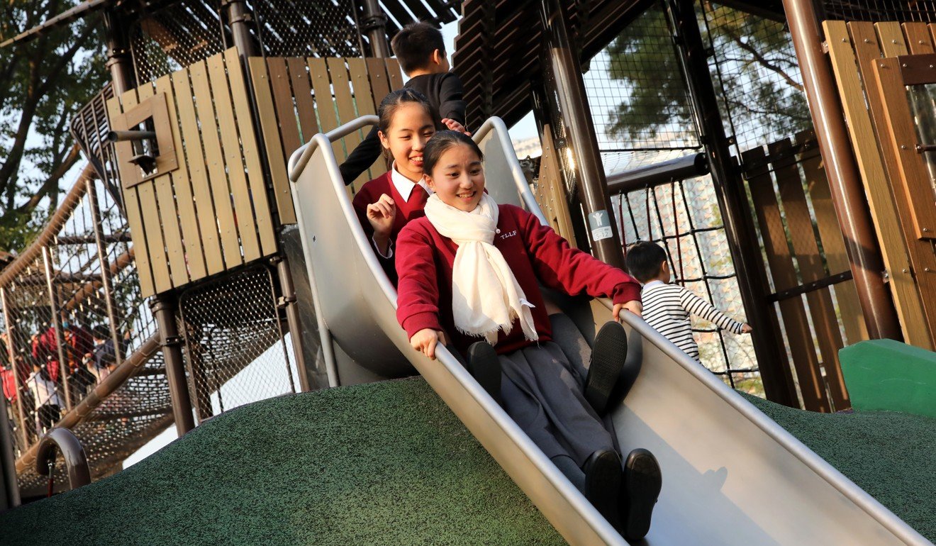 Lam Lam, 12, and Yau Lok-yee in Hong Kong’s first barrier-free government playground. Photo: K.Y. Cheng