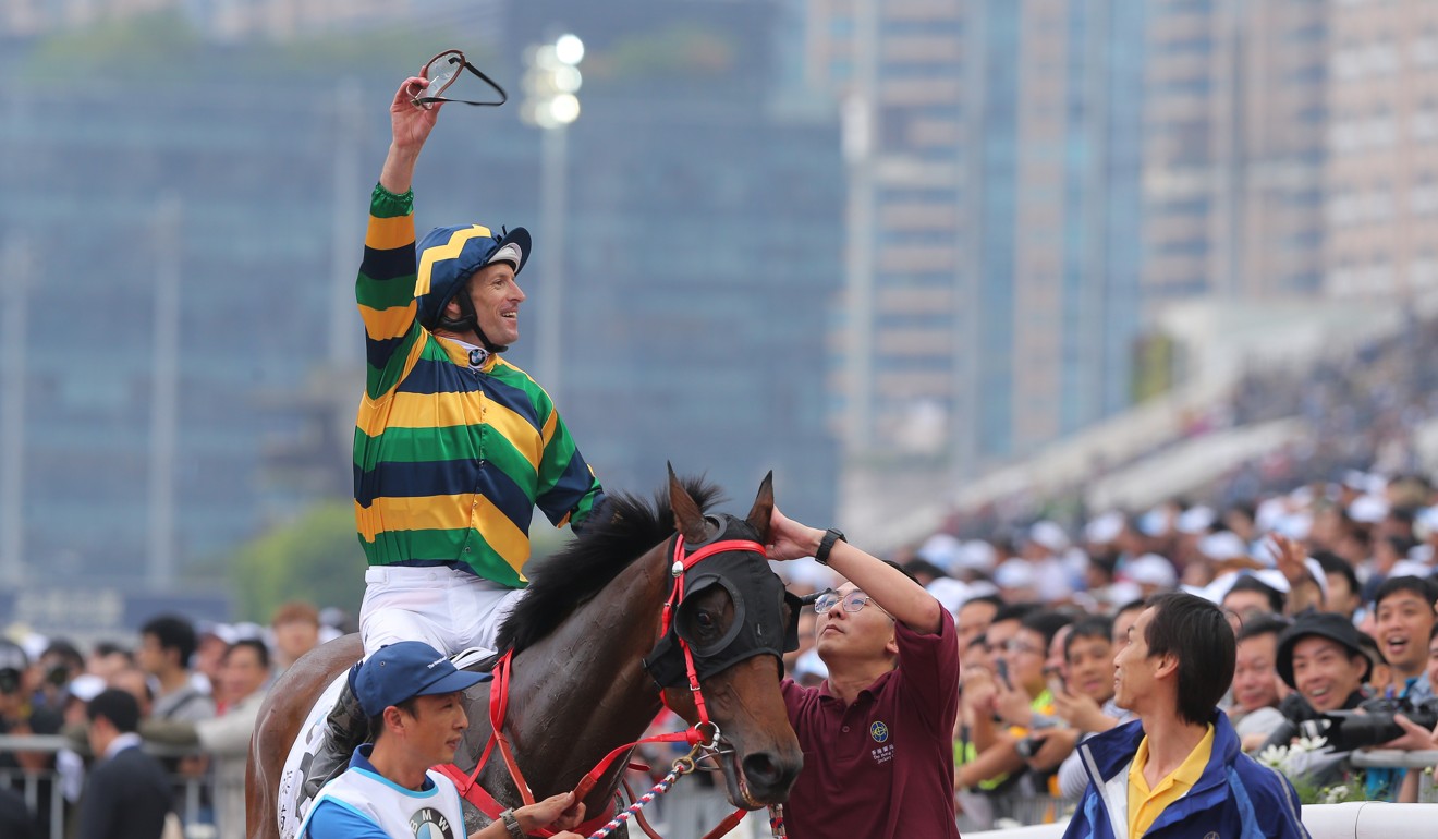 Jockey Hugh Bowman celebrates the win of Furore in the Hong Kong Derby.
