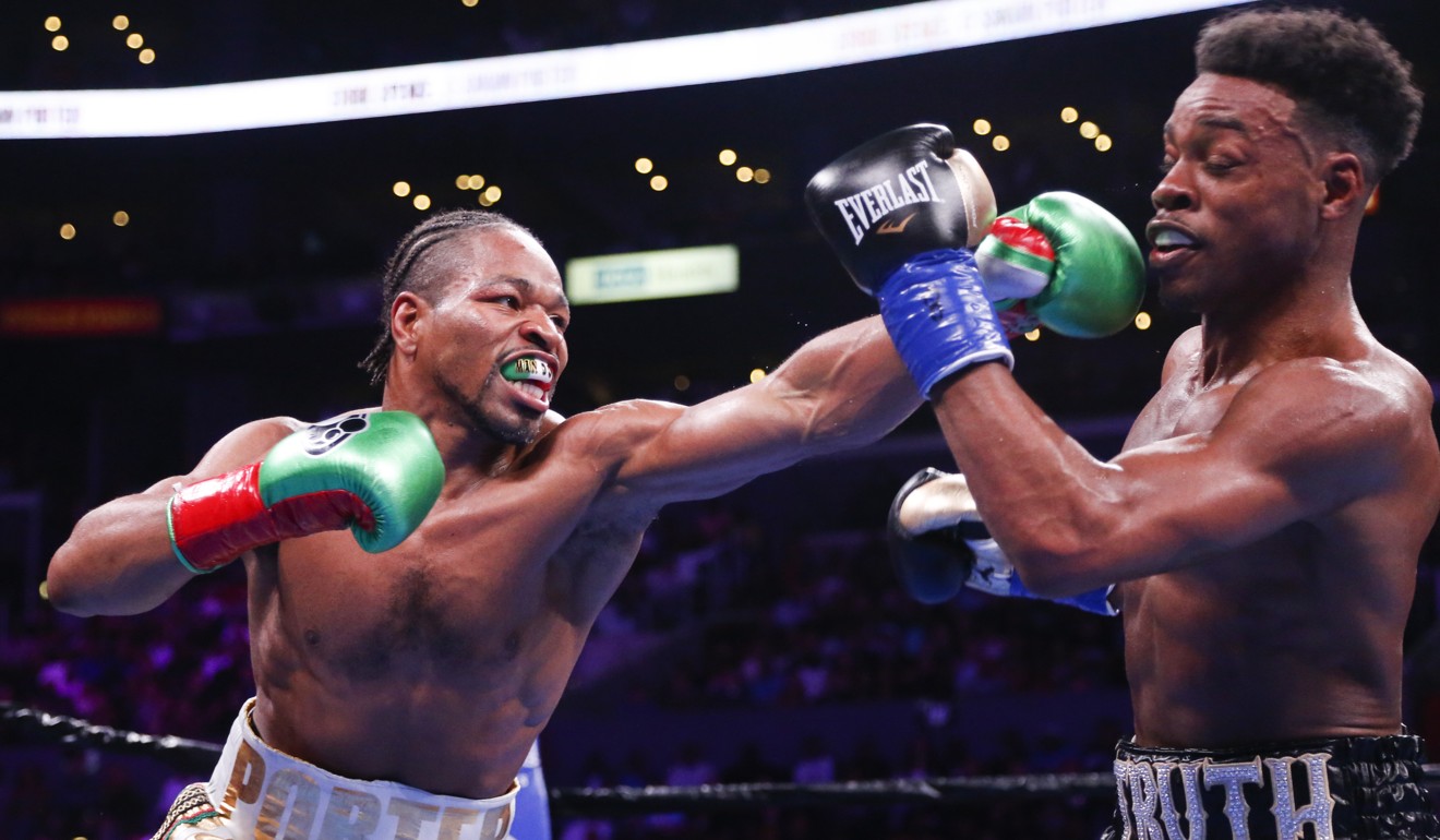 Errol Spence Jnr and Shawn Porter exchange punches. Photo: AP