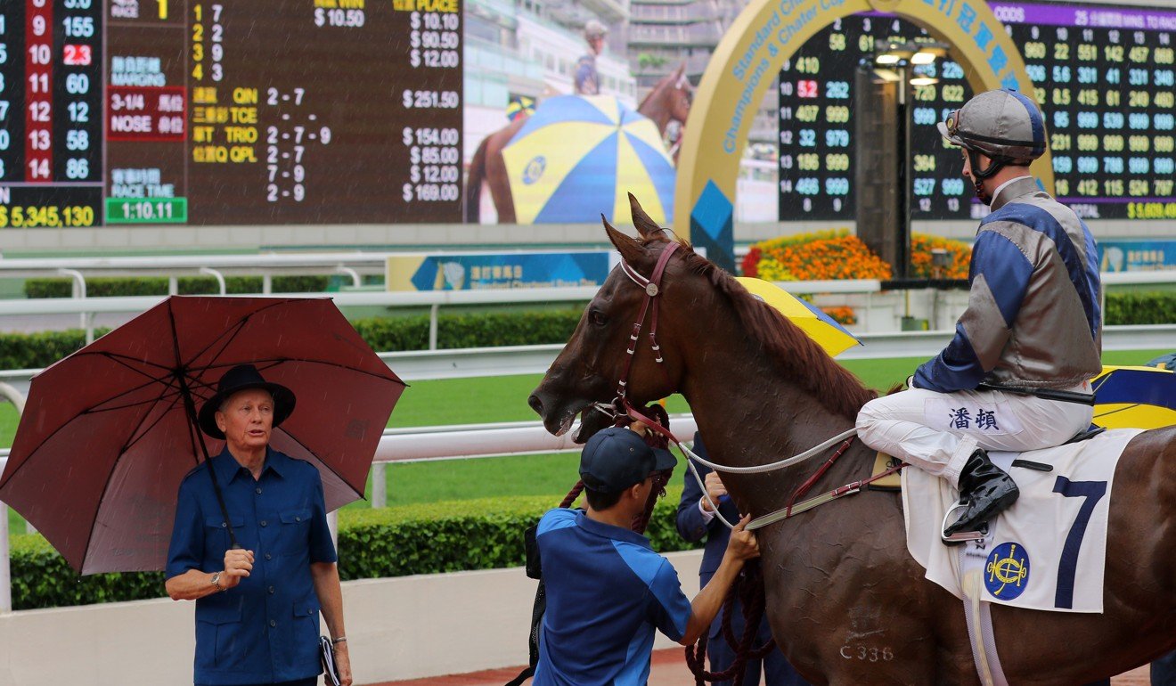 Trainer John Moore (left) and jockey Zac Purton talk after one of Aethero’s wins.