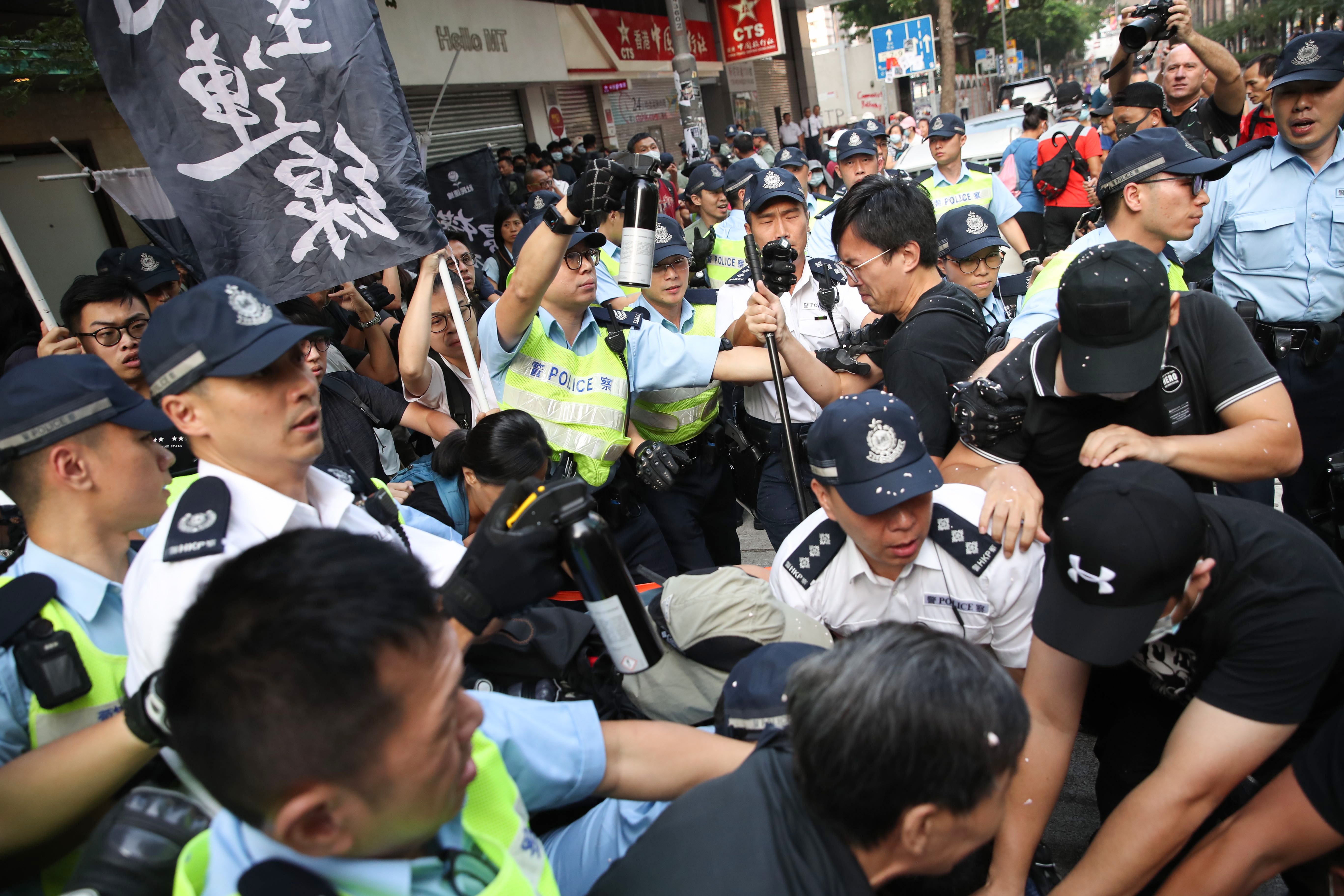 Clashes involving members of the League of Social Democrats on National Day in Wan Chai. Photo: Winson Wong