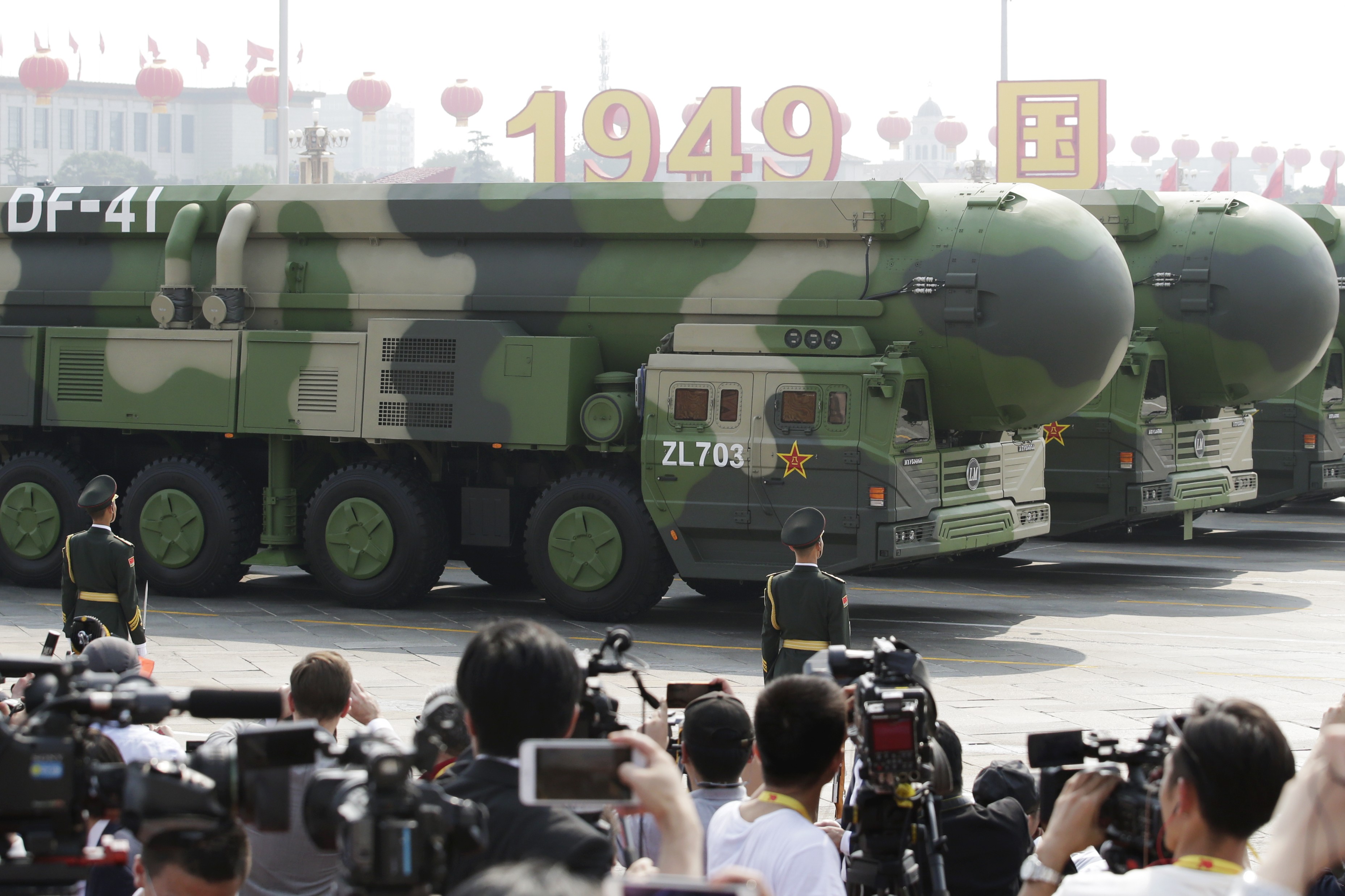 Military vehicles carrying DF-41 intercontinental ballistic missiles travel past Tiananmen Square during the parade on Tuesday. Photo: Reuters