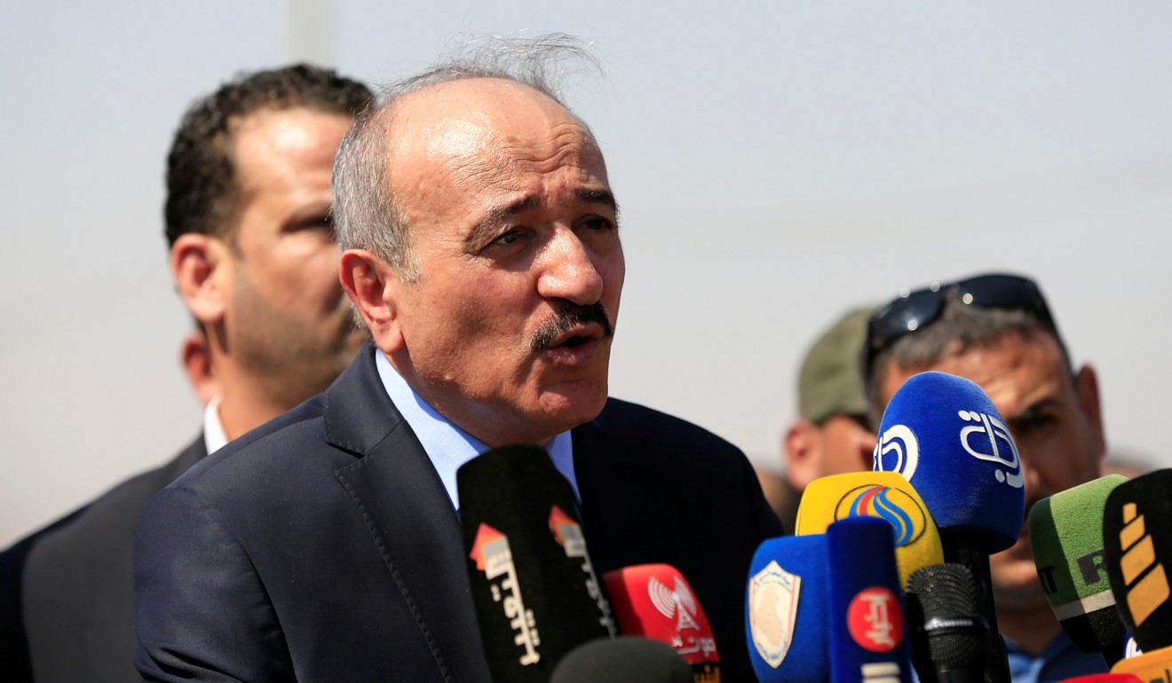 Syrian Interior Minister Major General Mohammed Khaled Rahmoun speaks during the reopening of the border crossing. Photo: Reuters