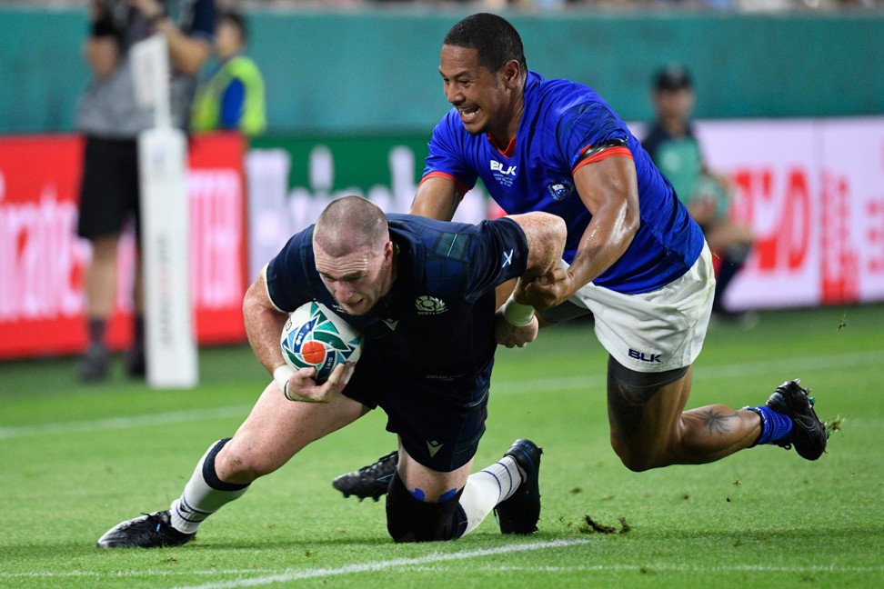 Scotland full back Stuart Hogg is under pressure by Samoa’s Ed Fidow. Photo: AFP
