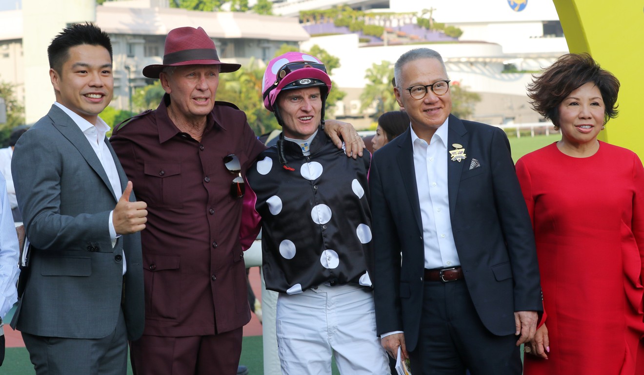 The Kwok family celebrate Beauty Generation’s win with trainer John Moore and jockey Zac Purton.