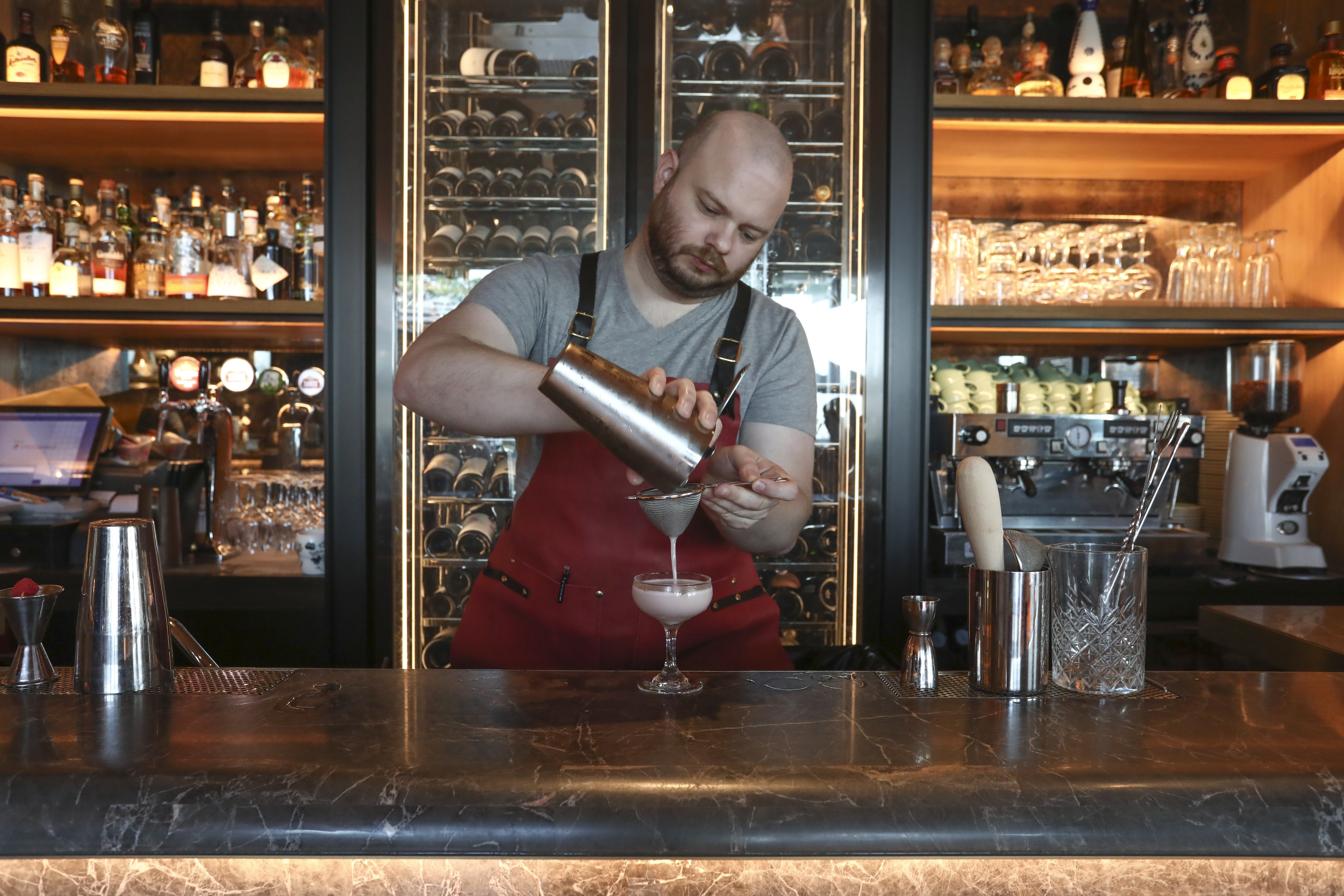 John Nugent mixes a Clover Club at La Rambla by Catalunya, in IFC Mall, Central. Picture: Jonathan Wong