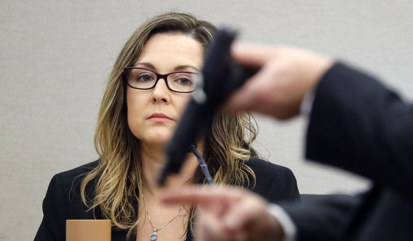 Dallas County Crime Lab supervisor April Kendrick watches as Assistant District Attorney Jason Hermus asks questions about Amber Guyger’s gun during the trial in Dallas on Thursday. Photo: Tom Fox/Dallas Morning News via AP