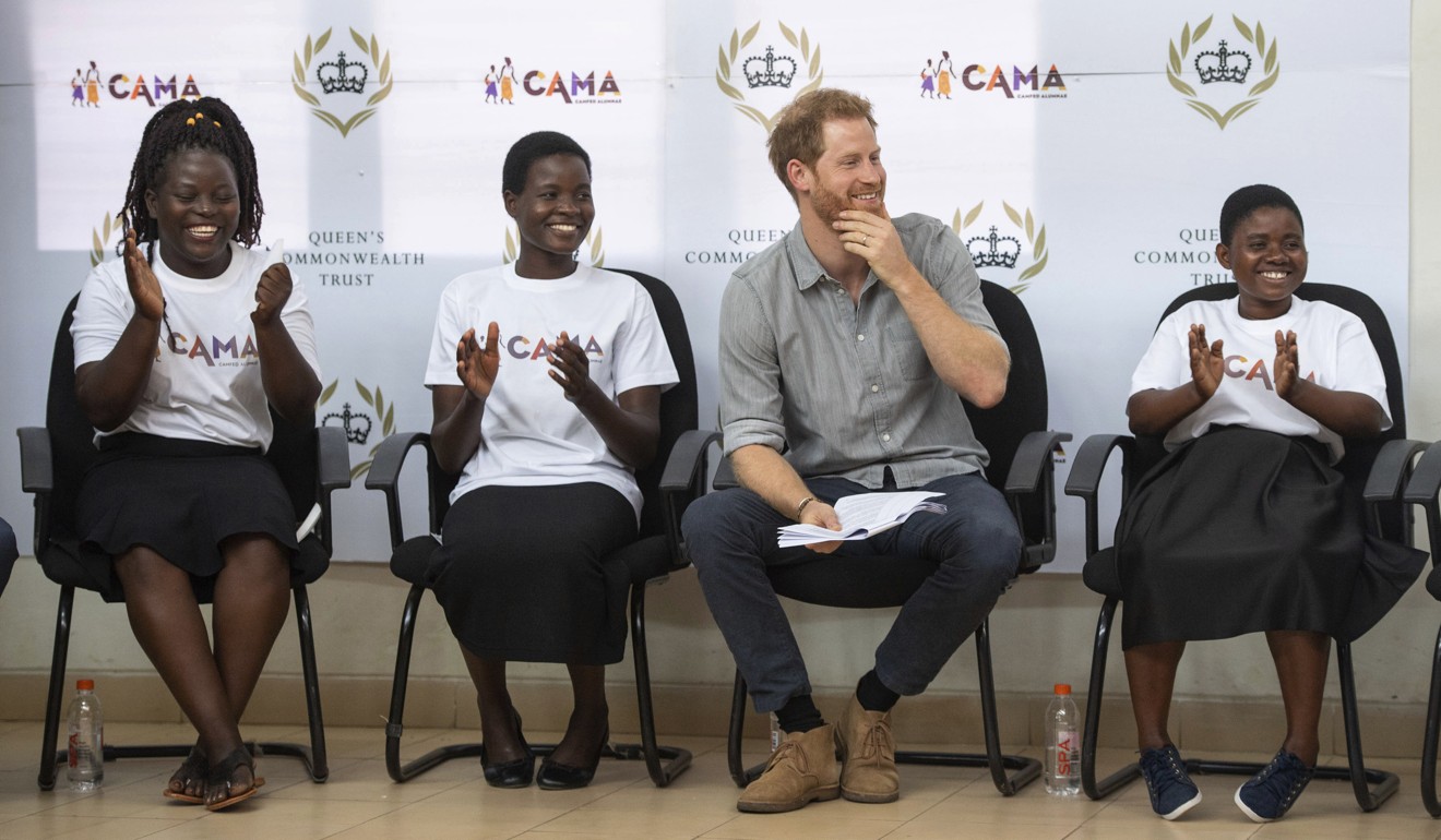 Britain's Prince Harry sits with students during a visit to the Nalikule College of Education in Lilongwe, Malawi, on Sunday. Photo: AP