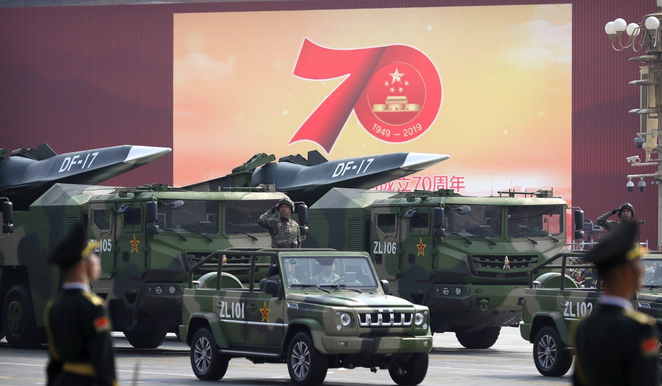 Chinese military vehicles carrying hypersonic DF-17 missiles pass through the centre of Beijing. Photo: AP