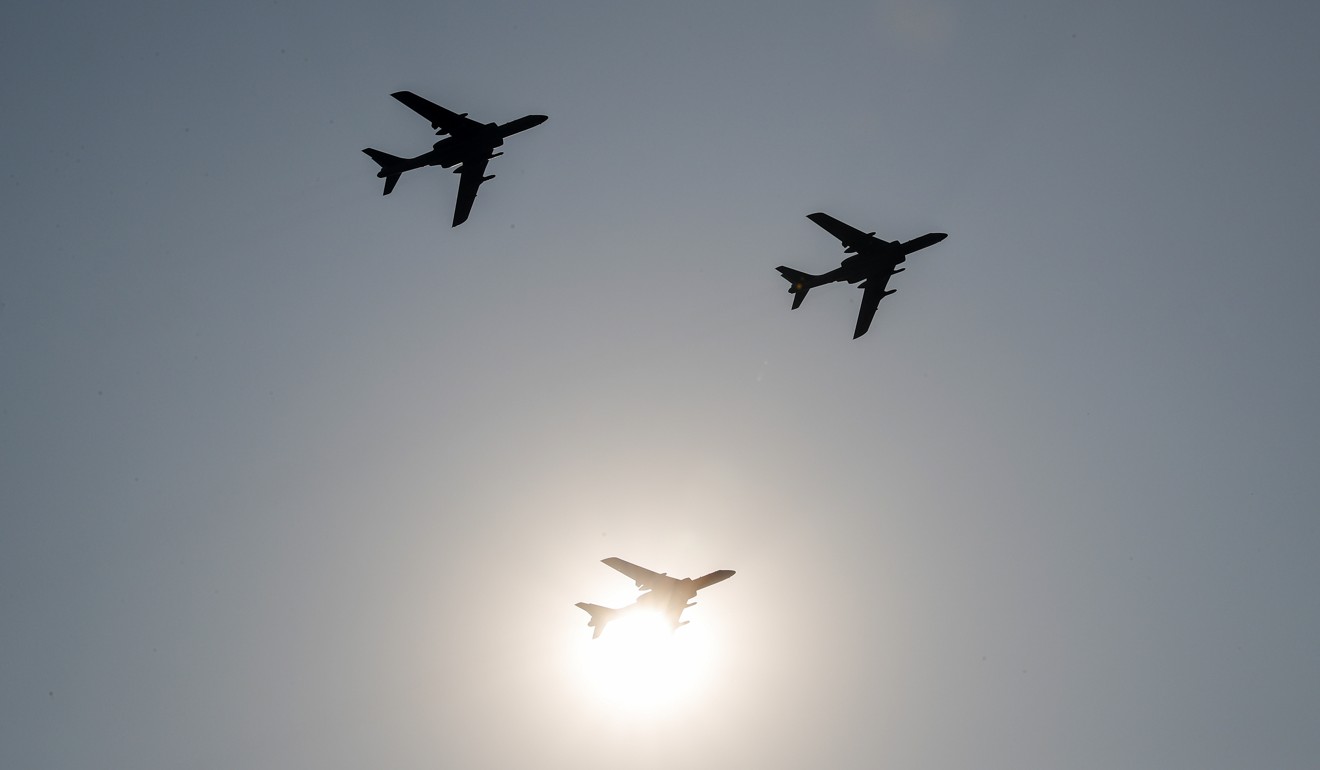 China’s H-6 bomber jets fly in formation over Beijing. Photo: AP