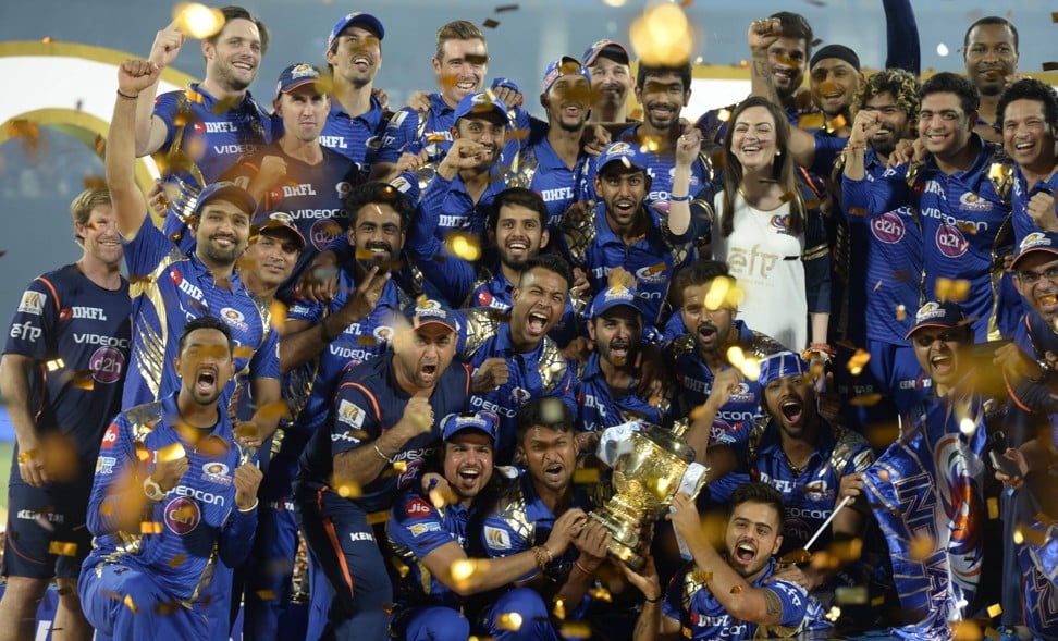 Mumbai Indians players and support staff and team owner Nita Ambani (right, in a white shirt) celebrate becoming the first team to win three IPL titles with a thrilling one-run victory over Rising Pune Supergiant in Hyderabad in May 2017. Photo: AFP