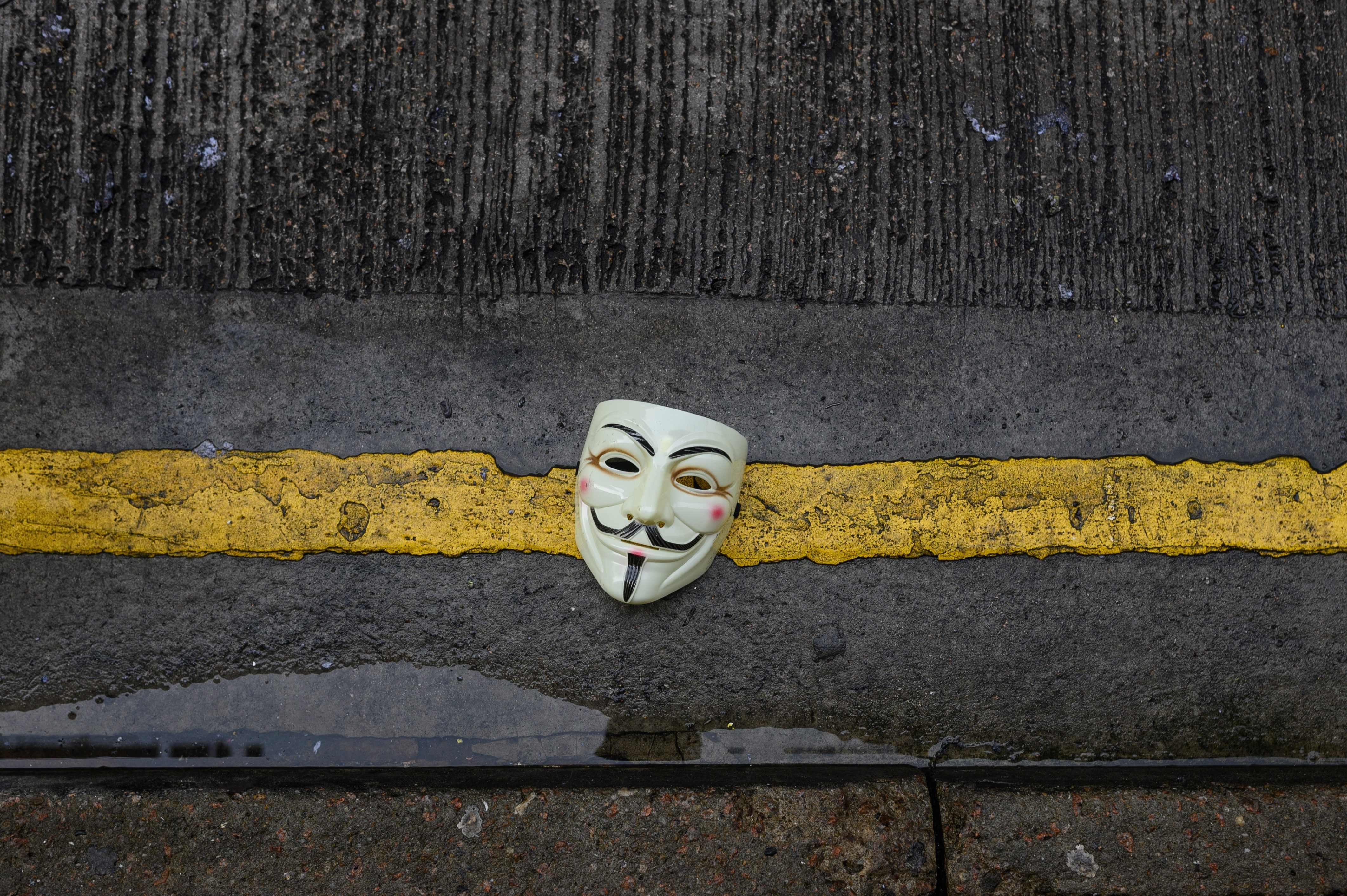 A mask left behind by protesters in Hong Kong’s Wan Chai district following clashes on September 29. An analyst said the impact of a face mask ban would be ‘neutral’. He said: “how are they going to enforce [the ban]?’ Photo: AFP