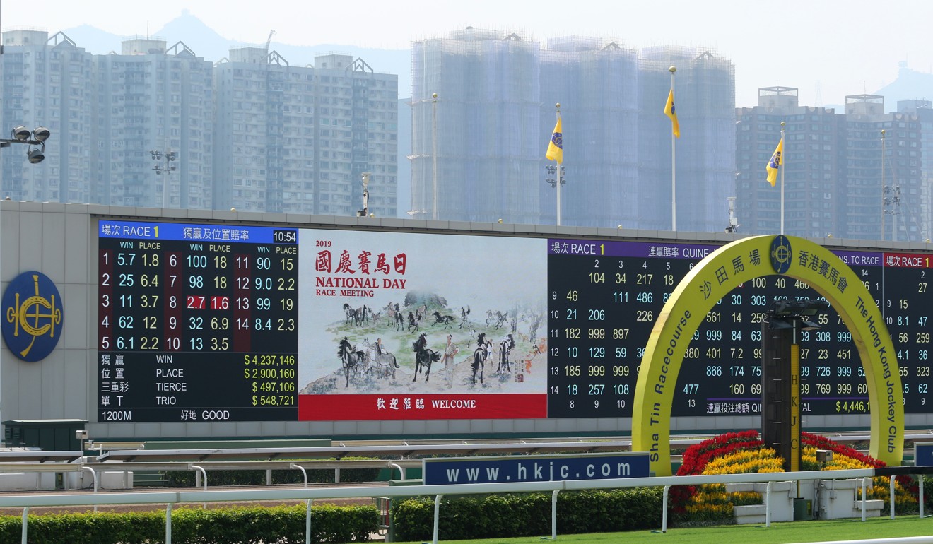 Jockey Club flags adorn the big screen at Sha Tin, replacing the flags of Hong Kong and China.