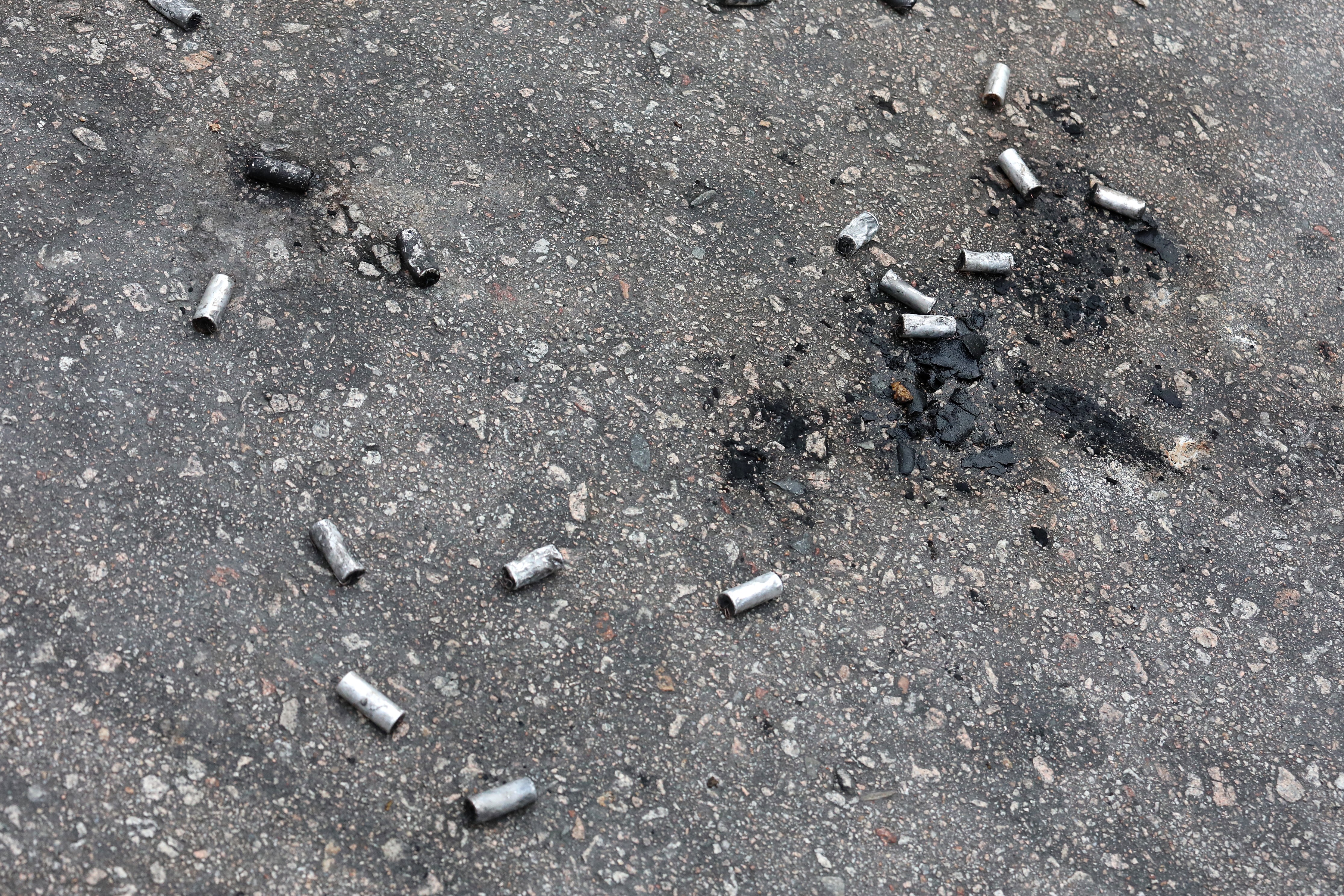 Shells are left on the ground after a night of clashes between the police and protesters in Yuen Long on July 27. Police have so far fired over 1,000 rounds of rubber bullets and beanbag rounds in an attempt to quell the protests. Photo: Felix Wong