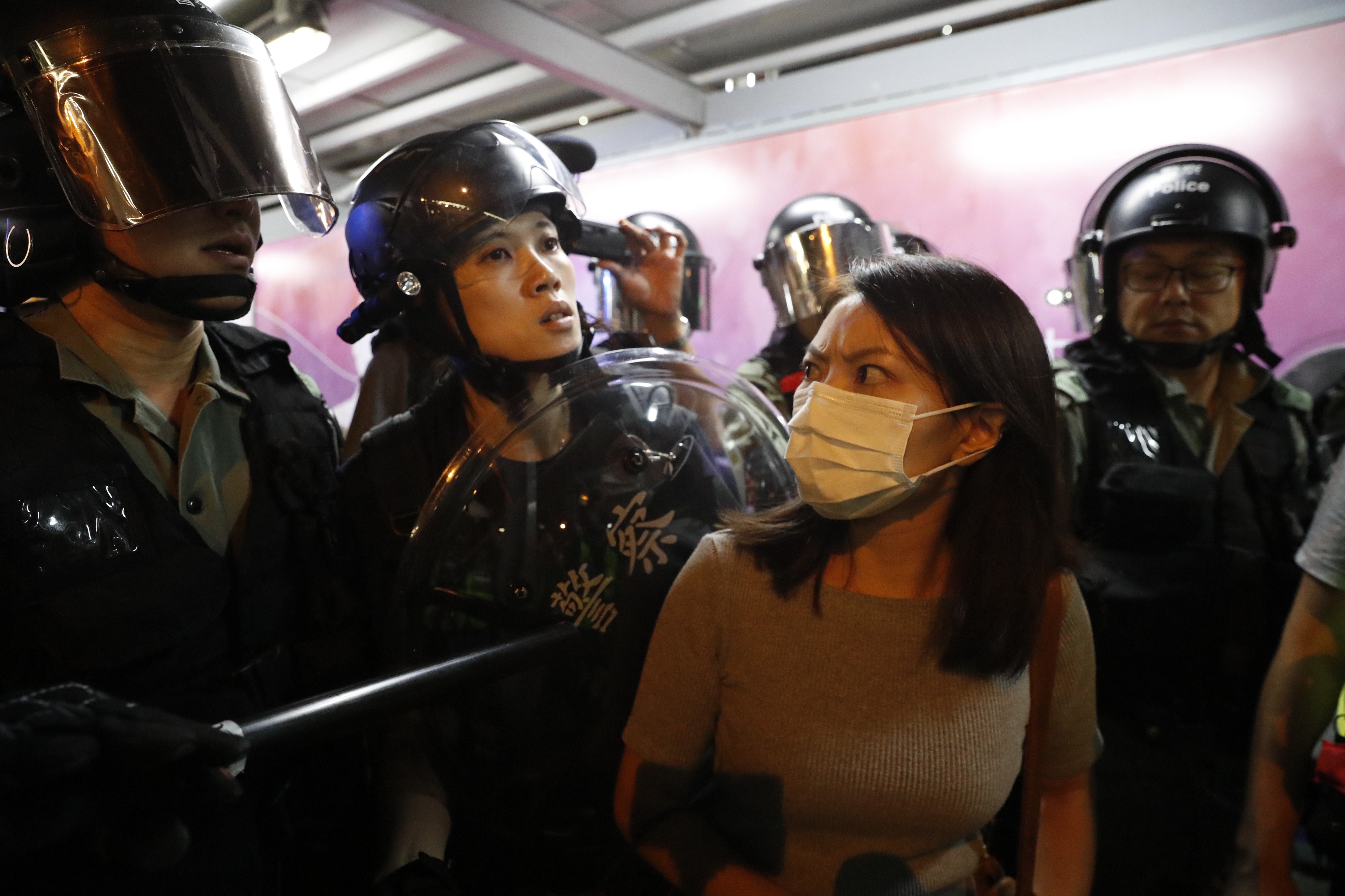 A member of the public reacts as police arrest people on suspicion of being anti-government protesters, in the Kowloon Bay area of Hong Kong on September 3. Photo: EPA-EFE