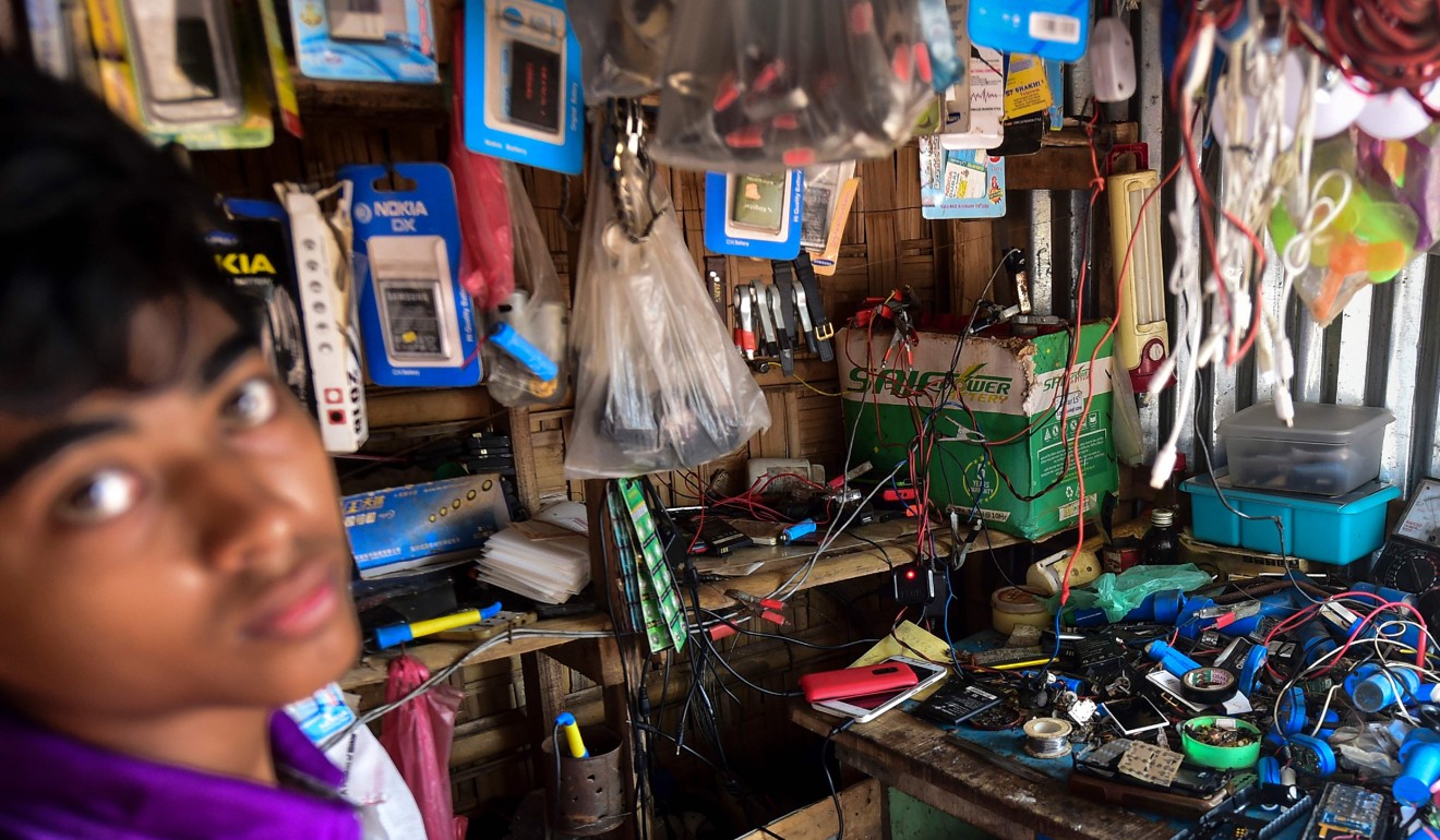 A Rohingya refugee youth looks on in a shop in a market area of the Kutupalong refugee camp in Ukhia in September. Photo: AFP