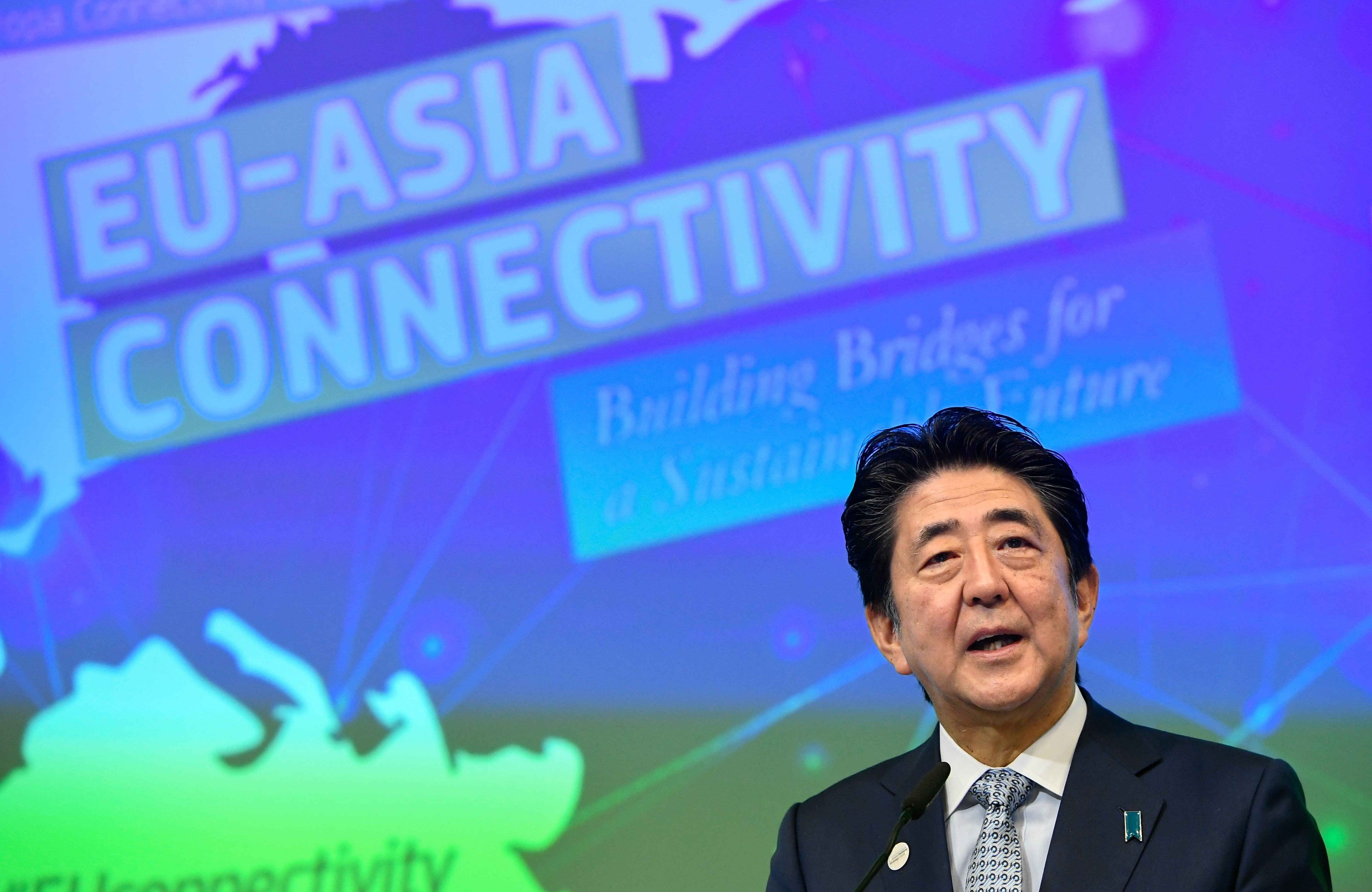 Japanese Prime Minister Shinzo Abe speaks at an EU-Asia Connectivity forum in Brussels on September 26. The EU says its connectivity strategy is sustainable and avoids debt traps and environmental impact. Photo: AFP