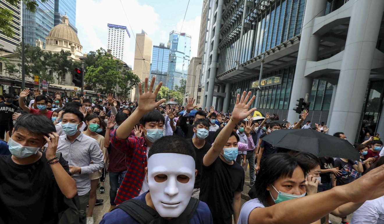 Demonstrators angered by the government’s ban of wearing masks at public assemblies have taken to the streets. Photo: Felix Wong