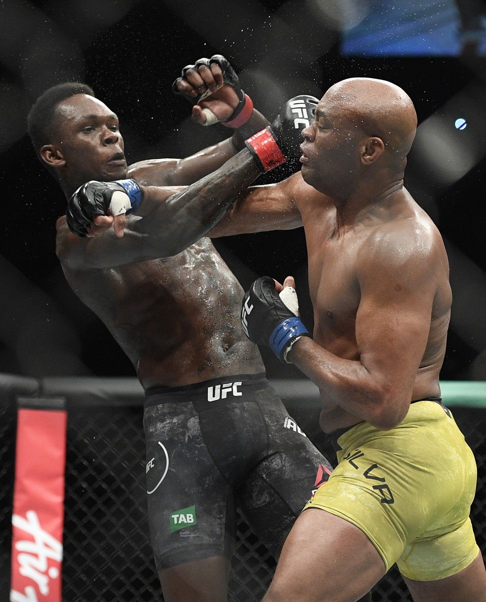 Israel Adesanya punches Anderson Silva at UFC 234 in Melbourne, Australia. Photo: AP