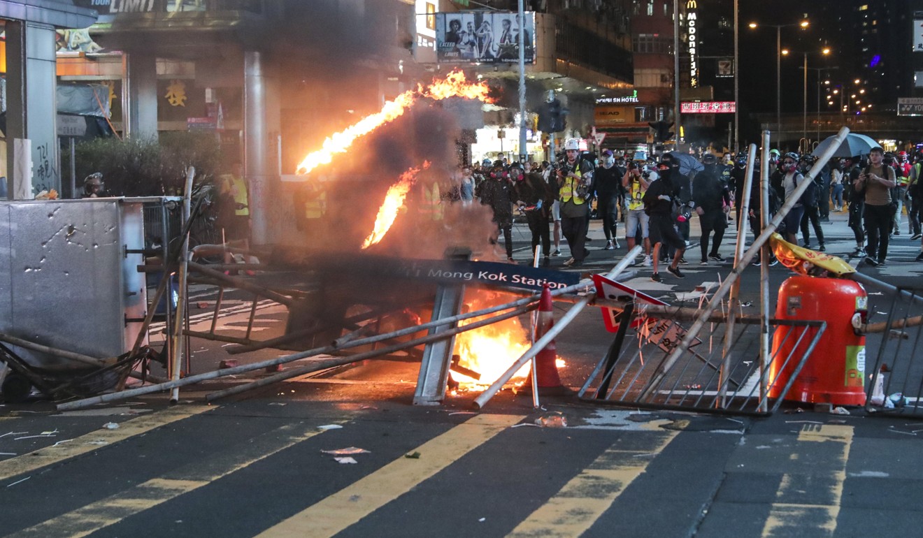 Barricades are set on fire in Mong Kok. Photo: Edmond So