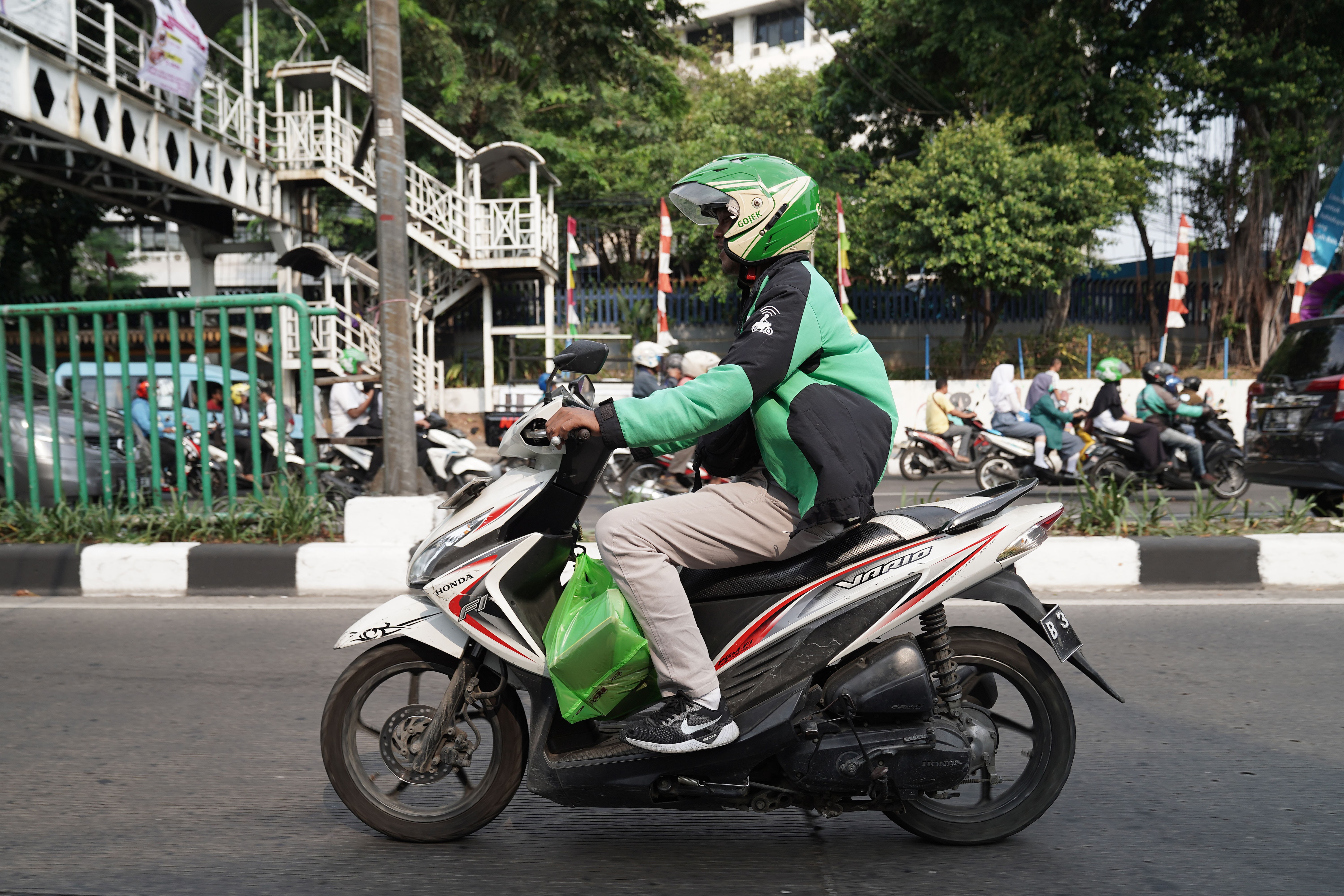 A GrabFood driver delivers an order in Jakarta, Indonesia. Photo: Bloomberg