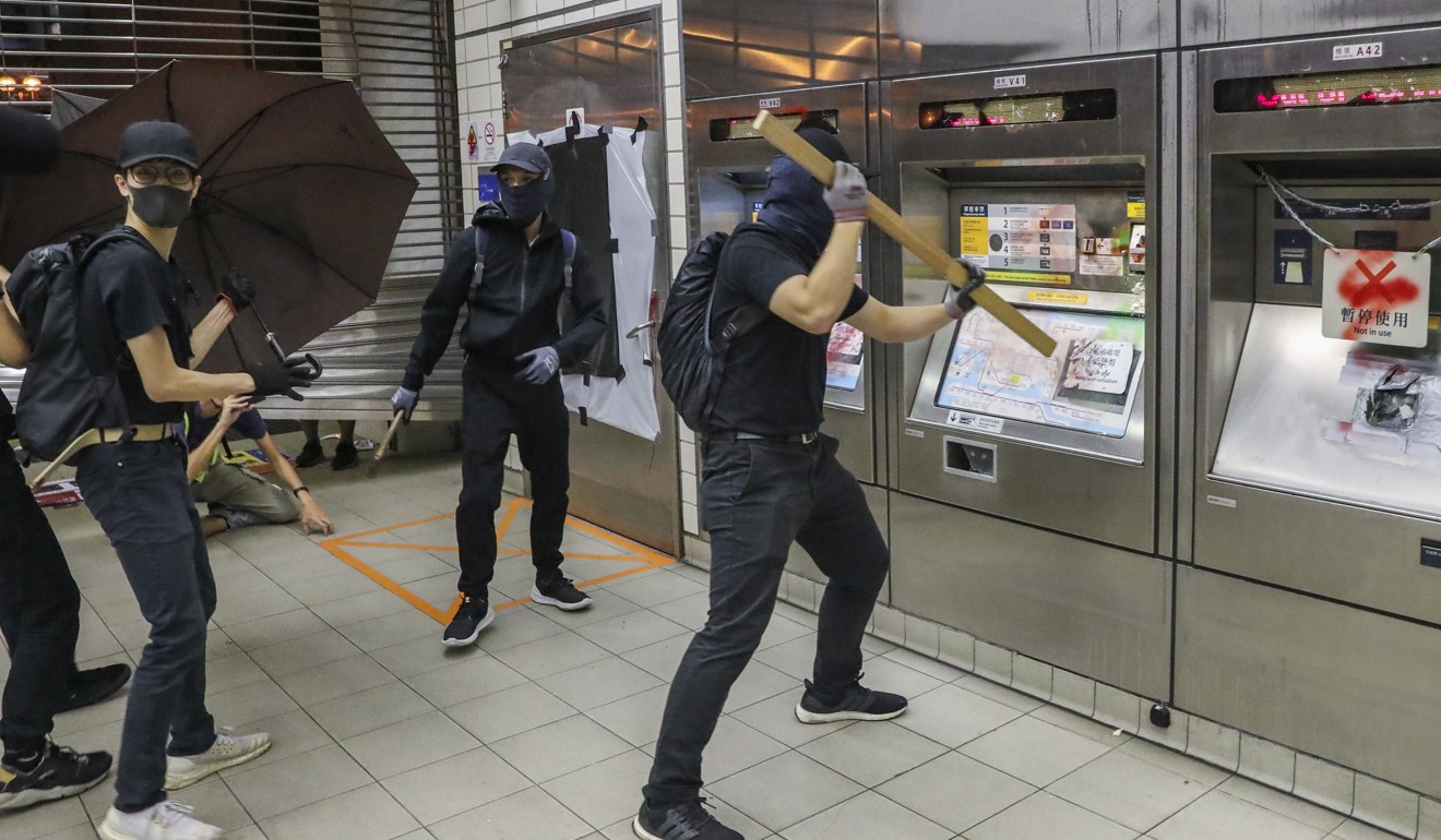 Anti-government protesters vandalise MTR facilities at Sha Tin Wai station on Monday. Photo: Sam Tsang