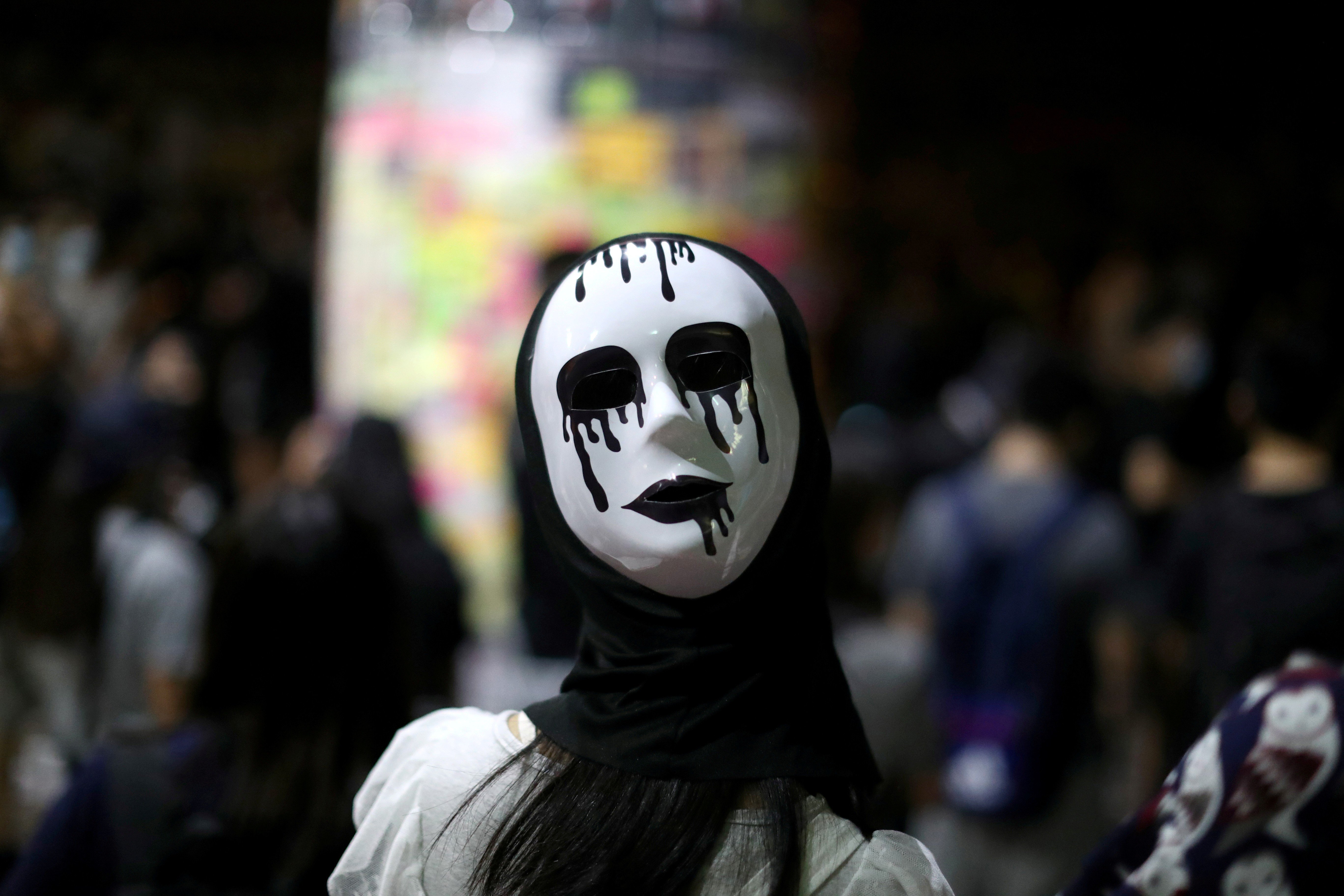 An anti-government protester wears a mask during a demonstration in Wong Tai Sin district on October 4. Photo: Reuters