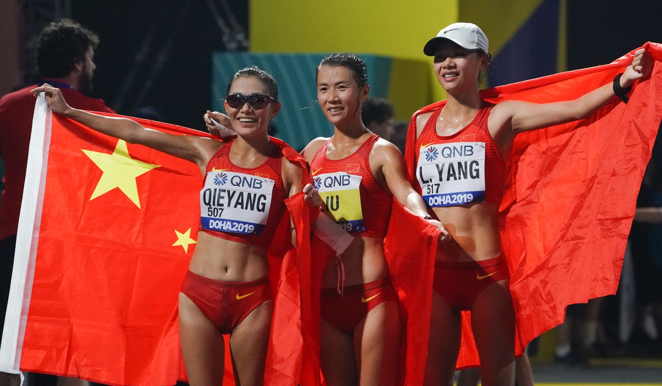 China’s Liu Hong (centre) celebrates with Qieyang Shenjie (left) and Yang Liujing after the 20km race walk final. Photo: Xinhua