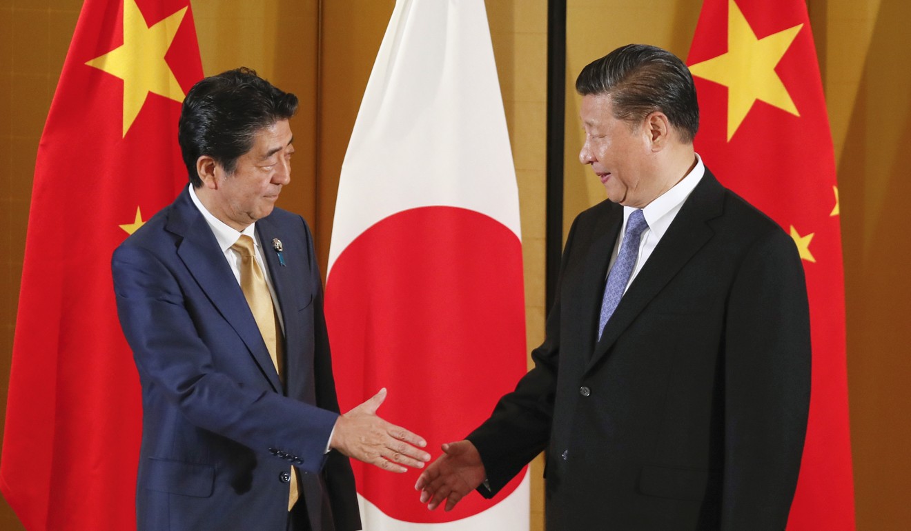 Chinese President Xi Jinping rolled out the red carpet for Japanese Prime Minister Shinzo Abe. Photo: EPA-EFE