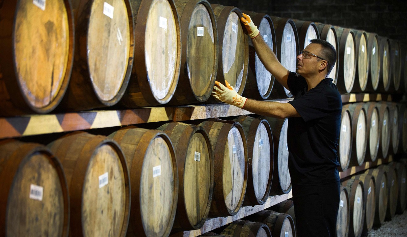 Barrels of whisky are seen at a distillery on the outskirts of Glasgow, Scotland. The US will impose a new set of tariffs on some goods imported from the European Union, with effect from October 18, including French wine, Italian cheese and single-malt Scotch whisky. Photo: AFP