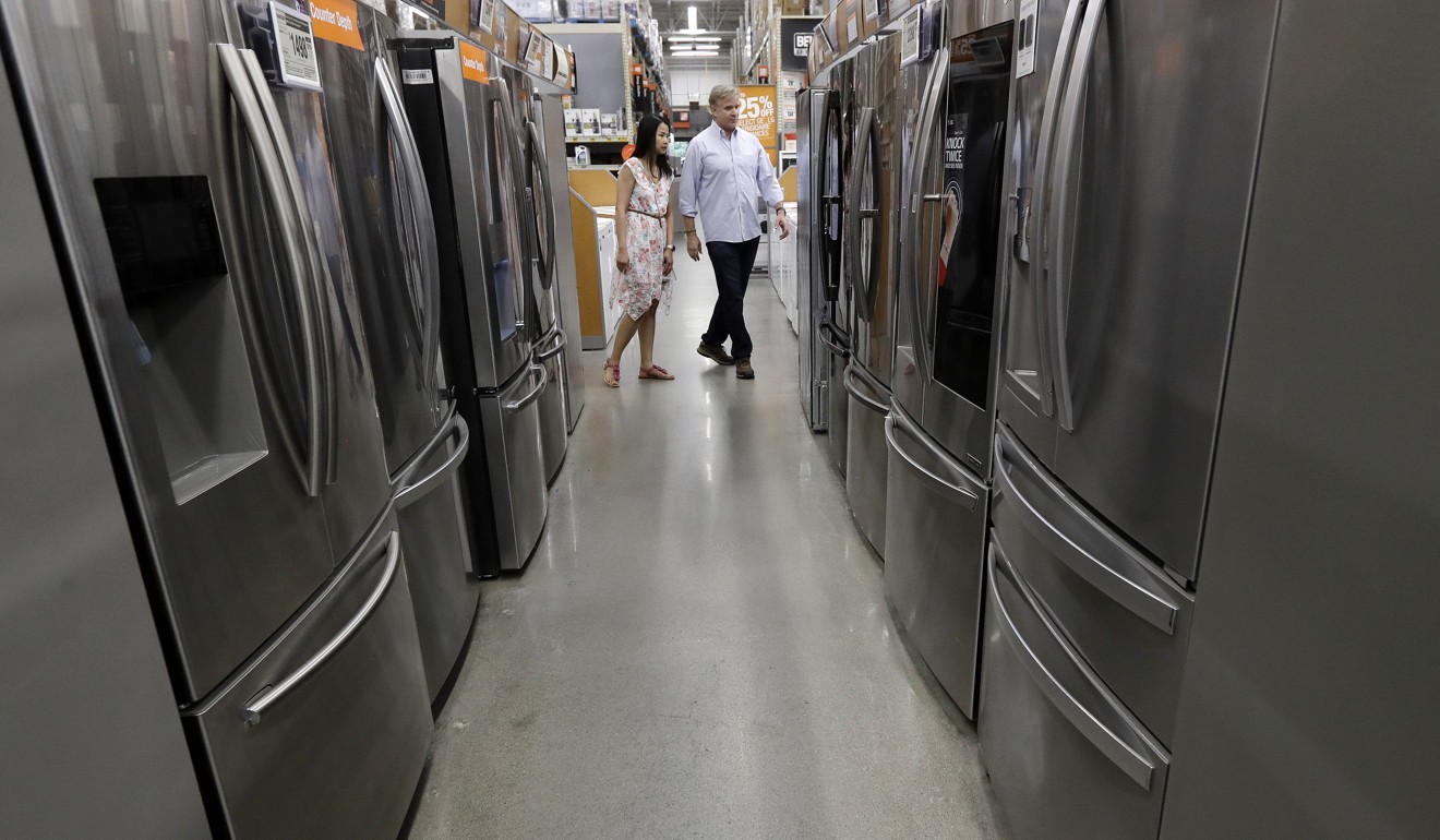 Shoppers look at fridges in a Home Depot store in Boston. US consumer spending only increased marginally in August, while, in one survey, US consumer confidence registered its biggest fall in nine months in September. Photo: AP