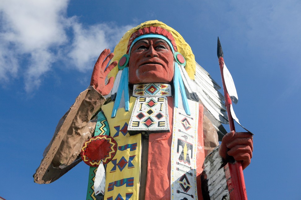A statue of a Native American at a souvenir shop along the Mohawk Trail, in Massachusetts. Photo: Alamy