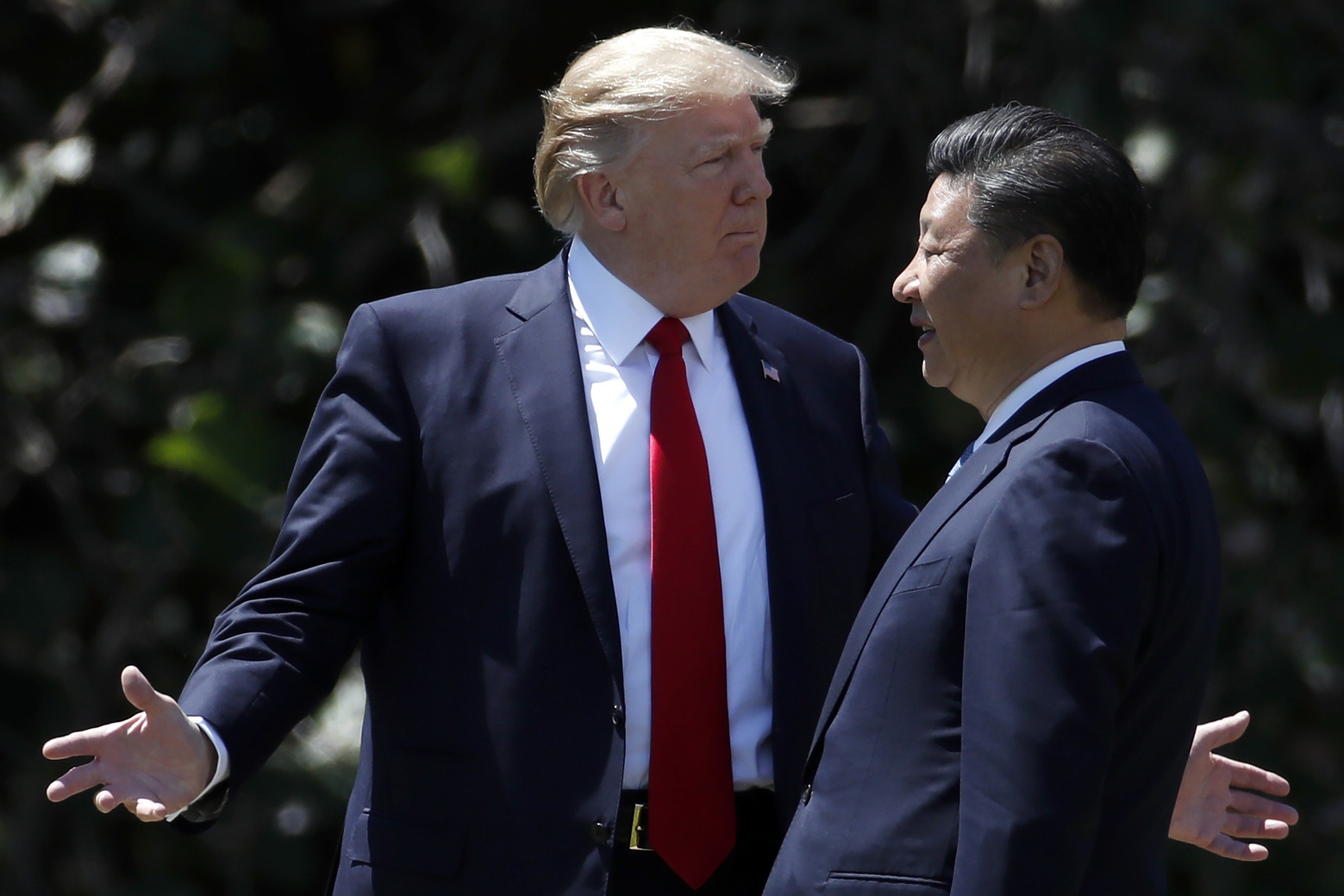US President Donald Trump walks with Chinese President Xi Jinping at Mar-a-Lago in Palm Beach, Florida, in April 2017. Trump’s administration has challenged China, most notably through the trade war, but the need to keep the US economy strong in an election year may push him to let up. Photo: AP