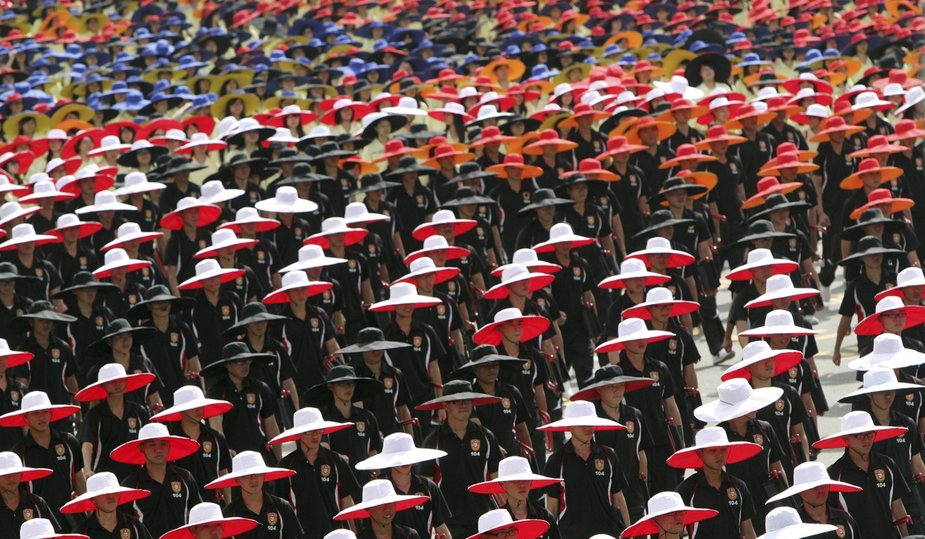 Taiwanese students in coordinated colours march during the 2013 parade. Photo: AP