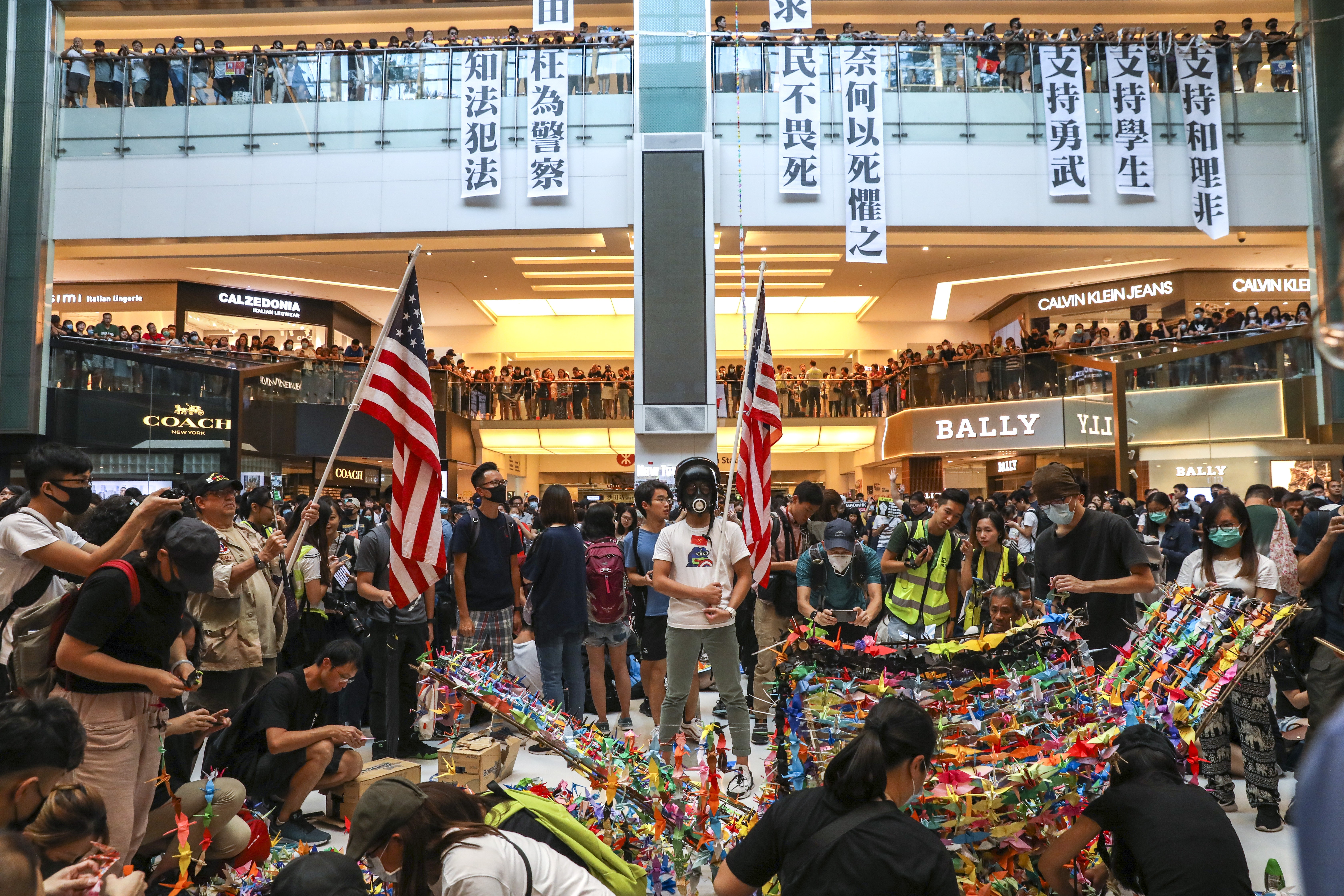 Protesters gather at New Town Plaza in Sha Tin on September 22. Sun Hung Kai Properties, the mall’s owner, has said it will help tenants affected by the protests. Photo: Nora Tam