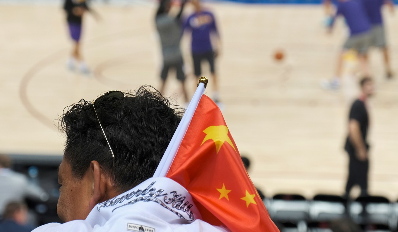 A fan sports the Chinese flag at the Los Angeles Lakers v Brooklyn Nets preseason game in Shenzhen on Saturday. Photo: Reuters