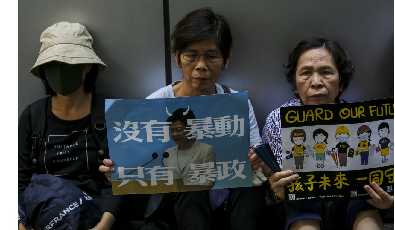 Elderly protesters outside police headquarters in Wan Chai on Saturday. The group’s protest in July drew an estimated 9,000 people. Photo: Jonathan Wong