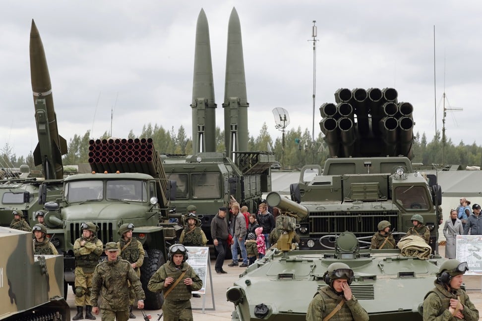 Visitors look at Russian tactical ballistic missiles and rocket launchers at a 2017 exhibition in St Petersburg. Photo: EPA
