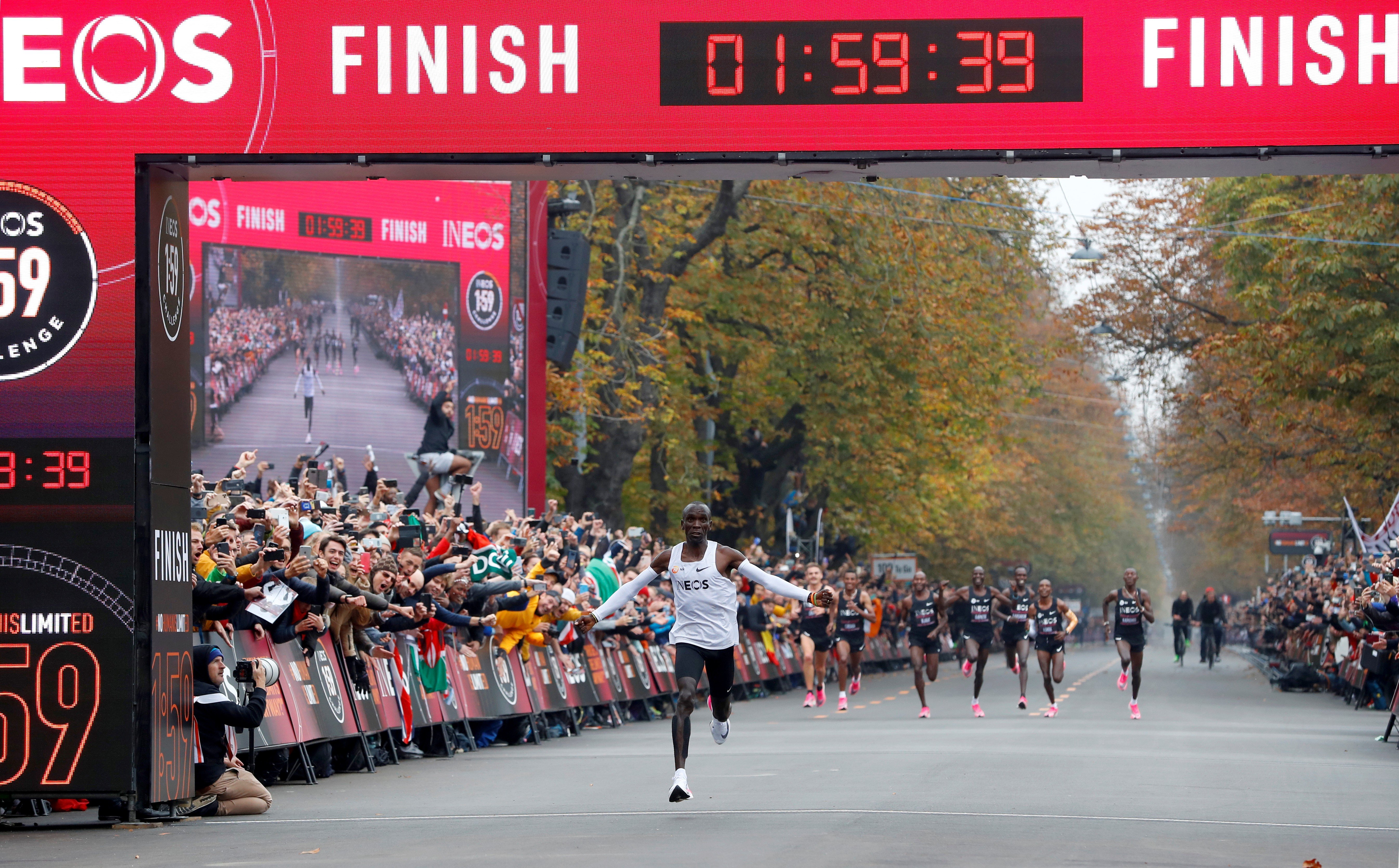 Kenya's Eliud Kipchoge, the marathon world record holder, crosses the finish line during his successful attempt to run a marathon in under two hours in Vienna. Photo: Reuters