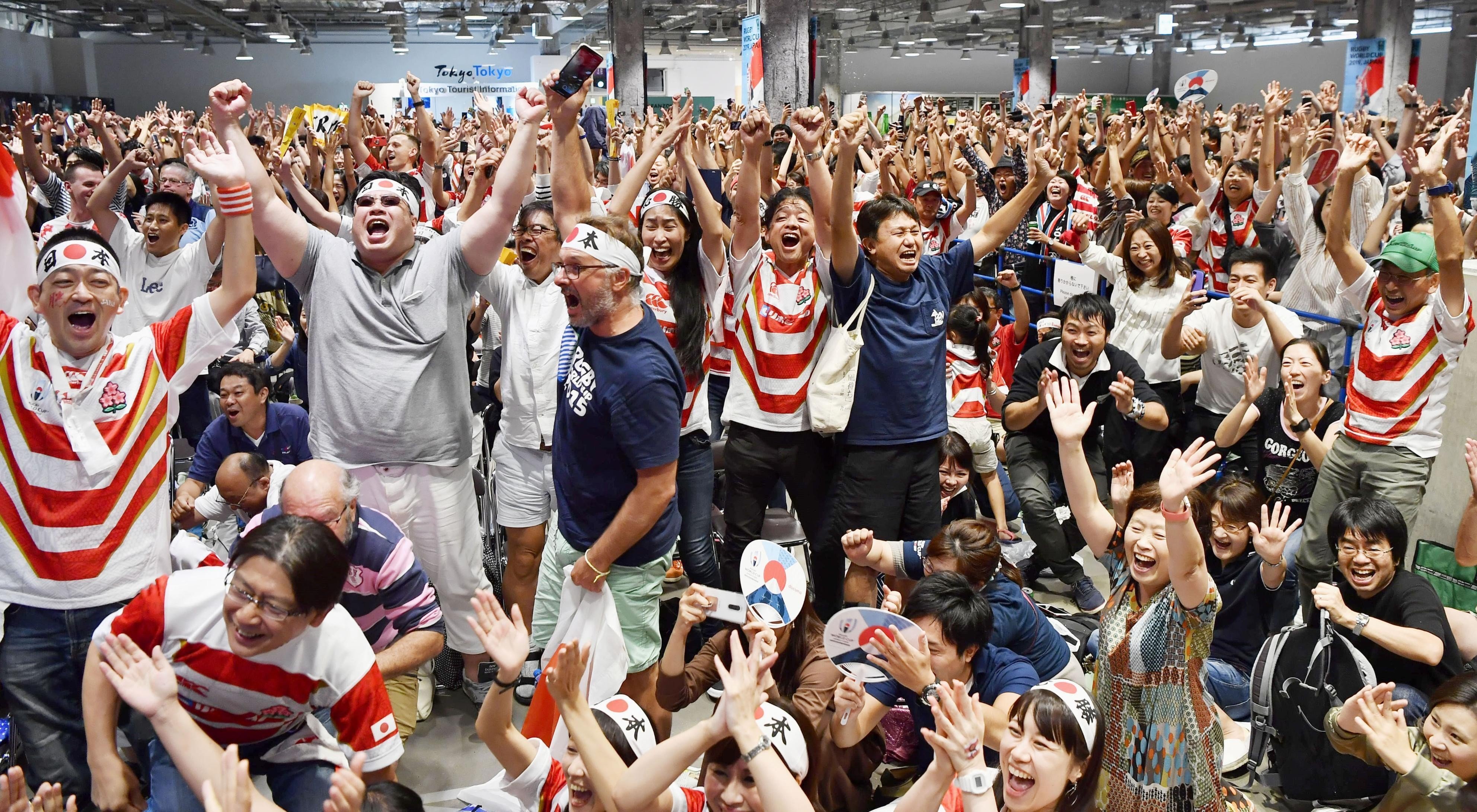 Japan fans celebrate the team’s win over Scotland at the Rugby World Cup. Photo: AP