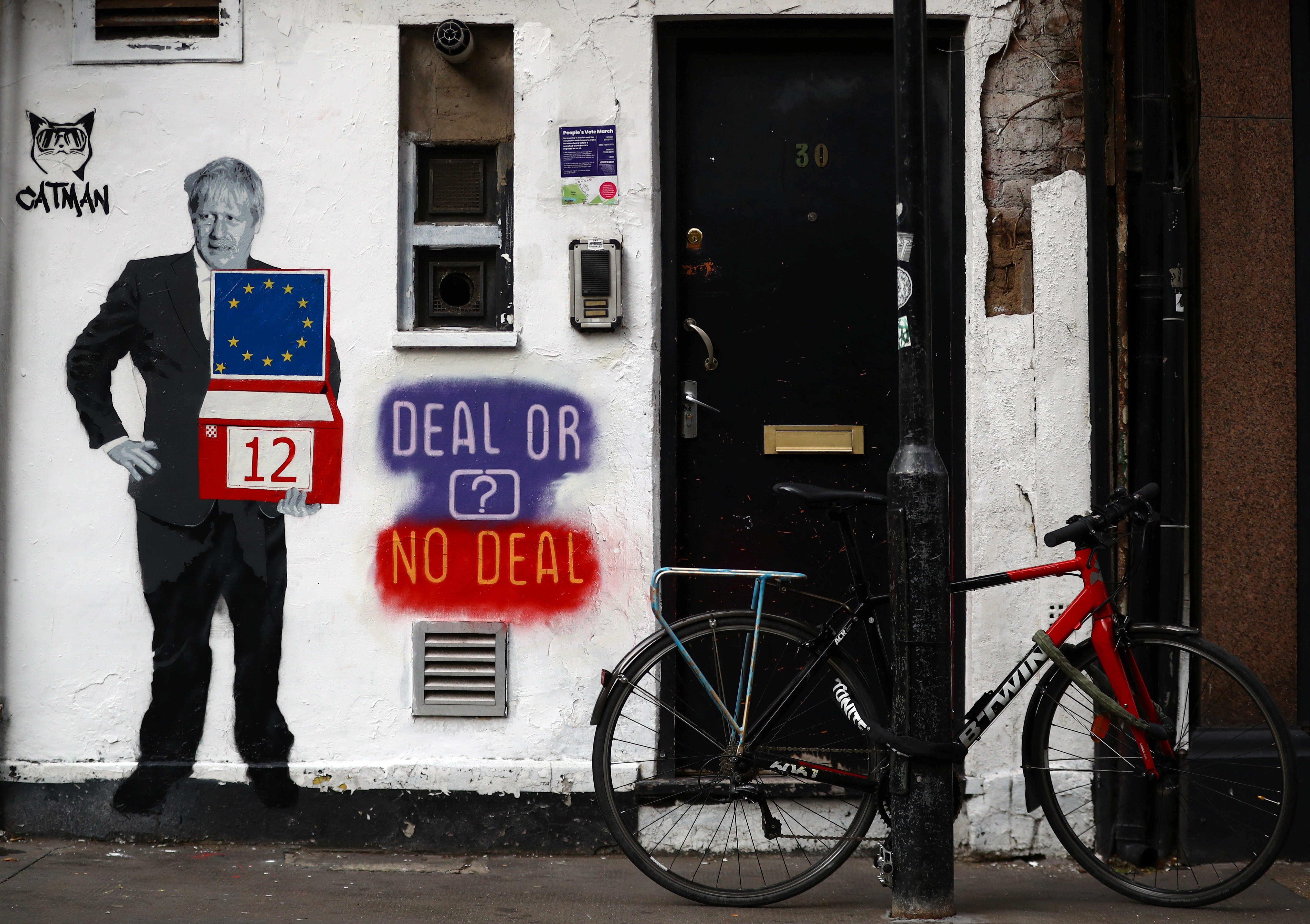 A mural depicting Britain's Prime Minister Boris Johnson is seen on the side of a residential building in London on Tuesday. Photo: Reuters