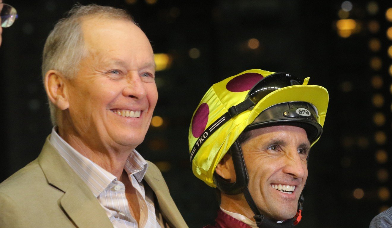 Trainer John Moore with jockey Neil Callan after Happy Warrior’s win at Happy Valley on Wednesday night.