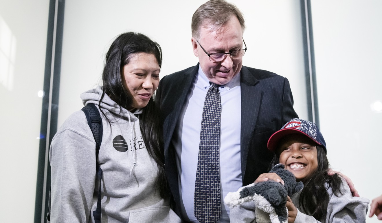 Vanessa Rodel, her daughter Keana and lawyer Robert Tibbo after arriving in Toronto in March. Photo: The Canadian Press via AP