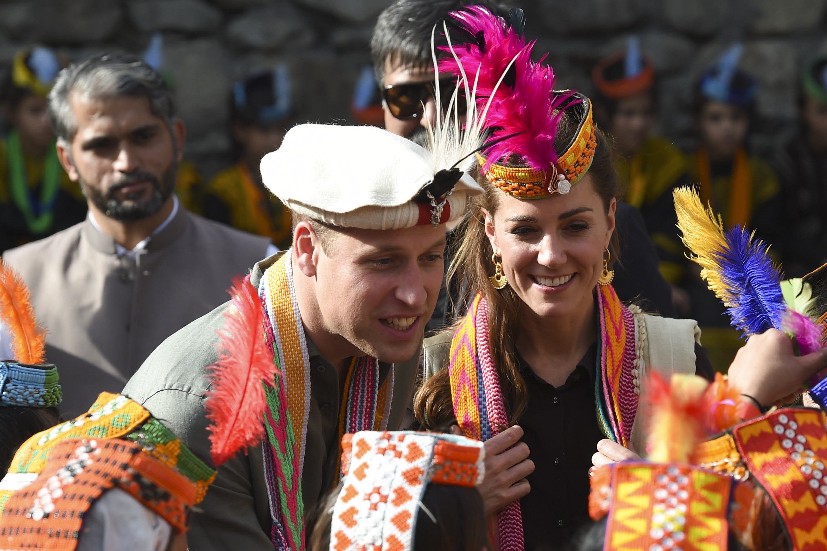 Britain's Prince William and his wife Kate Middleton visit the Bumburate Valley in Pakistan. The pair have been praised for cultural sensitivity in their choice of attire. Photo: AFP