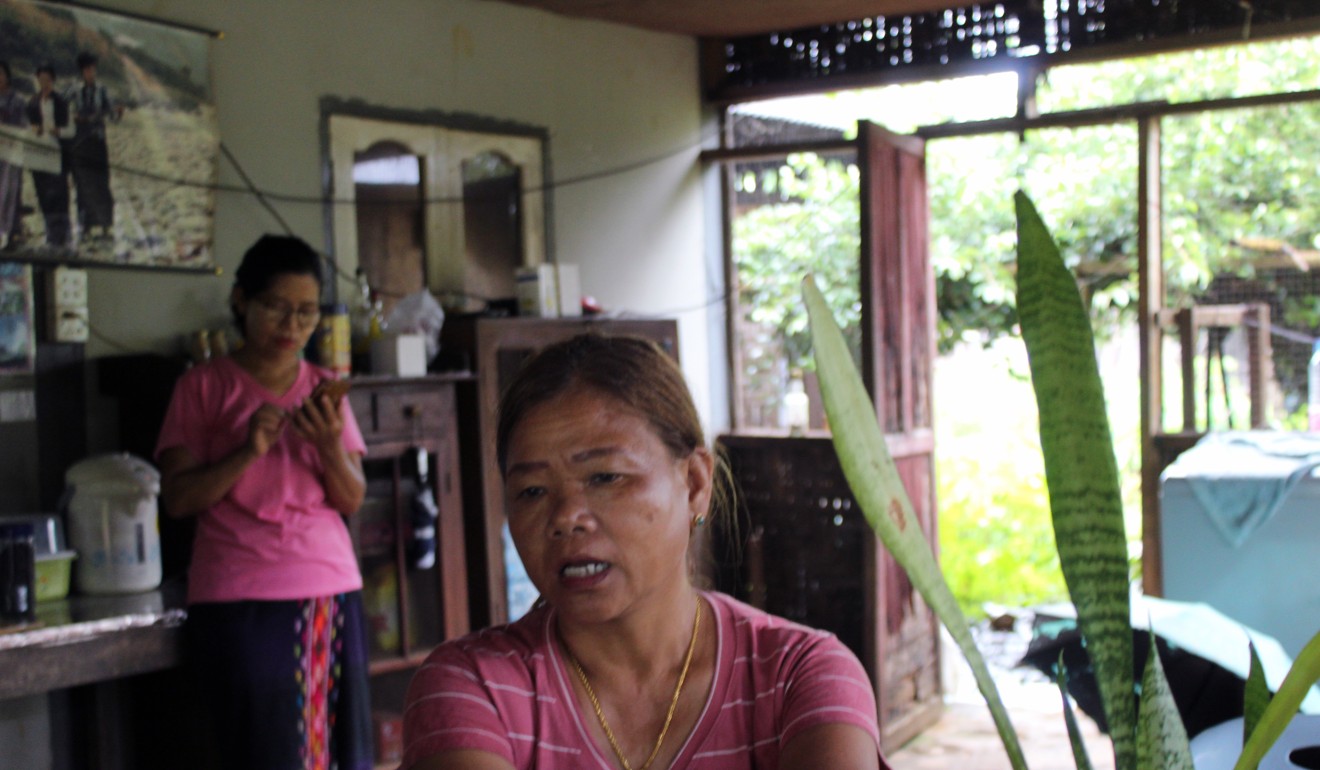 Lu Ra, who was displaced from her home in Tanghre to make way for the Myitsone project, speaks at her neighbour's home in Aung Myithar village. Photo: Oliver Slow